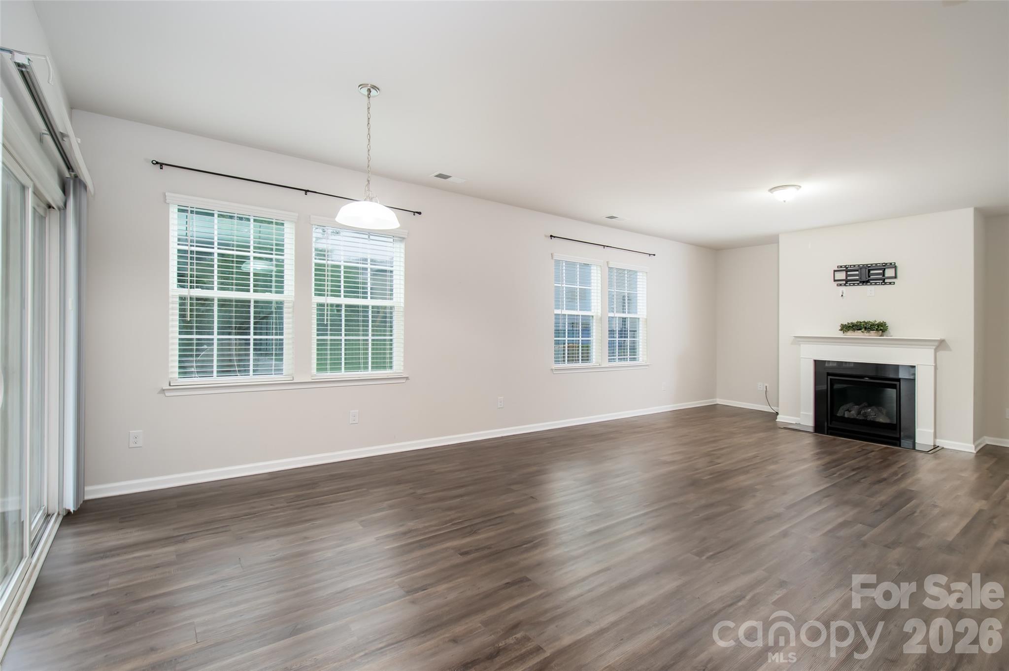 Open Floor Plan and Gas-Log Fireplace - 150 W Morehouse Avenue, Mooresville