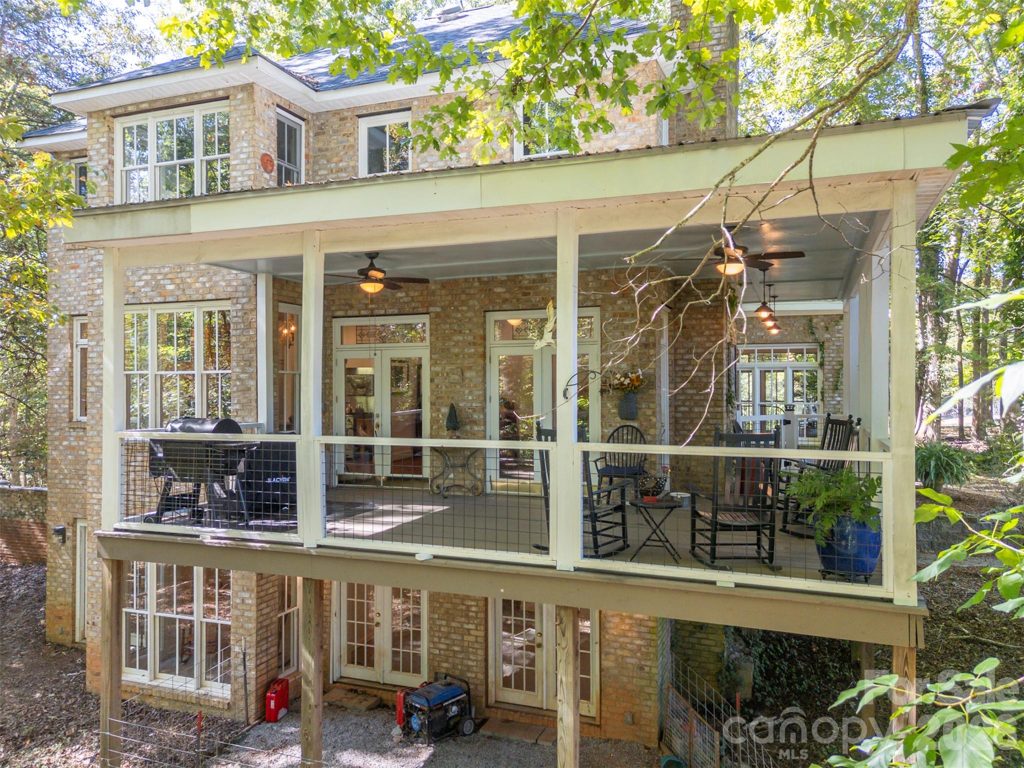 Rear View showing the 3 levels of the home. The wrap around porch is great for entertaining guests - 600 John Weaver Road, Columbus