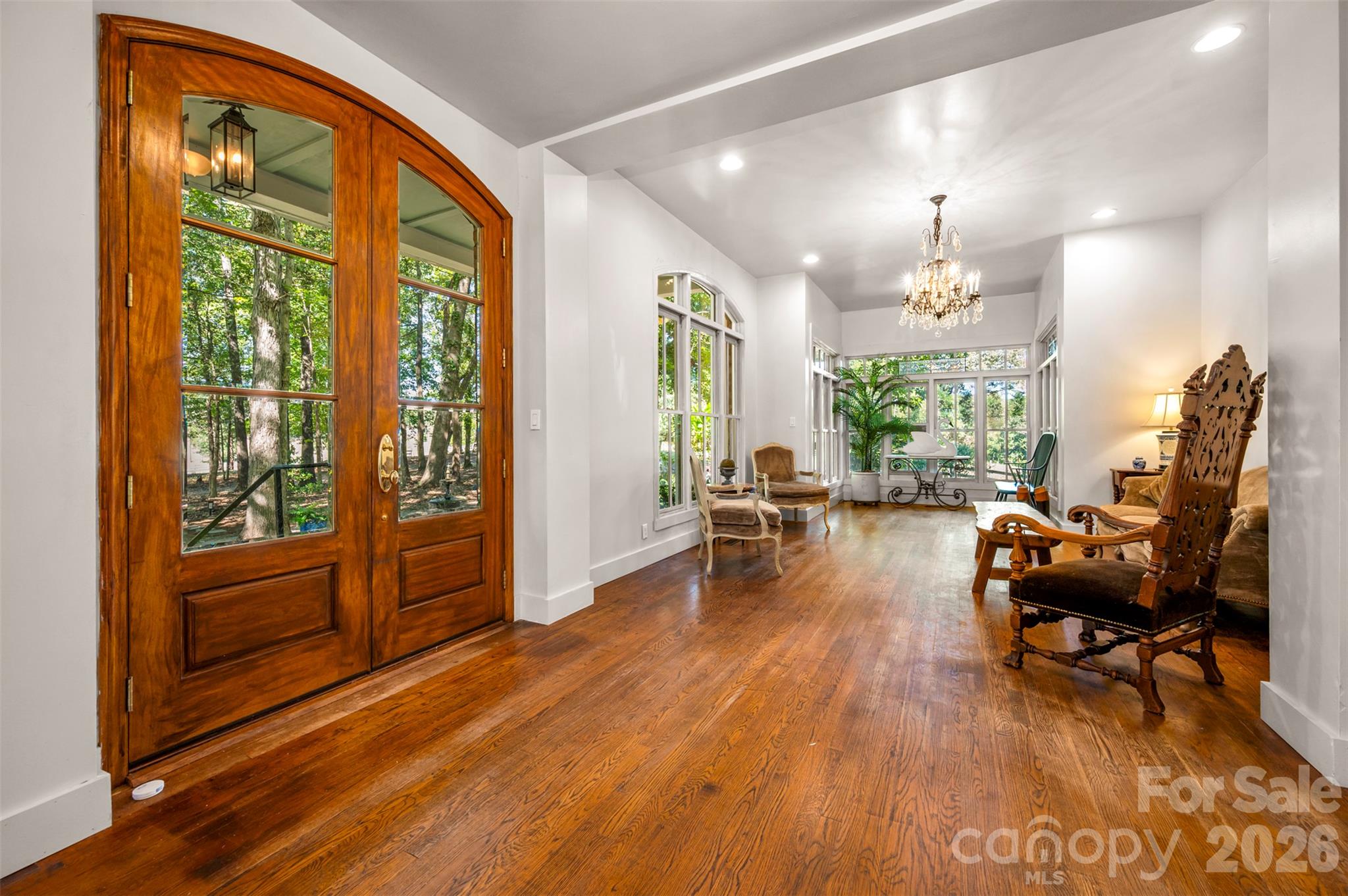 View to living room and sunroom in the distance. - 600 John Weaver Road, Columbus