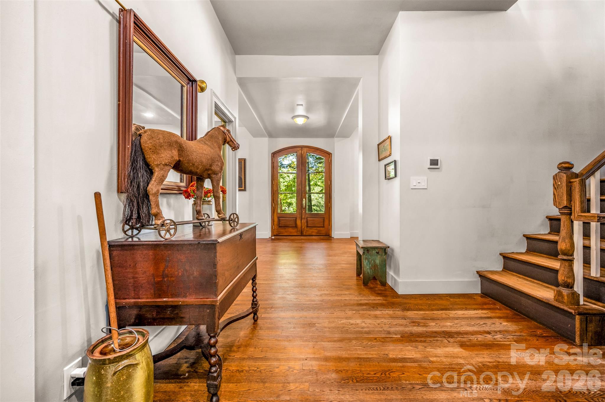 View from kitchen area to front door. Stairs to the right for up and down levels. - 600 John Weaver Road, Columbus