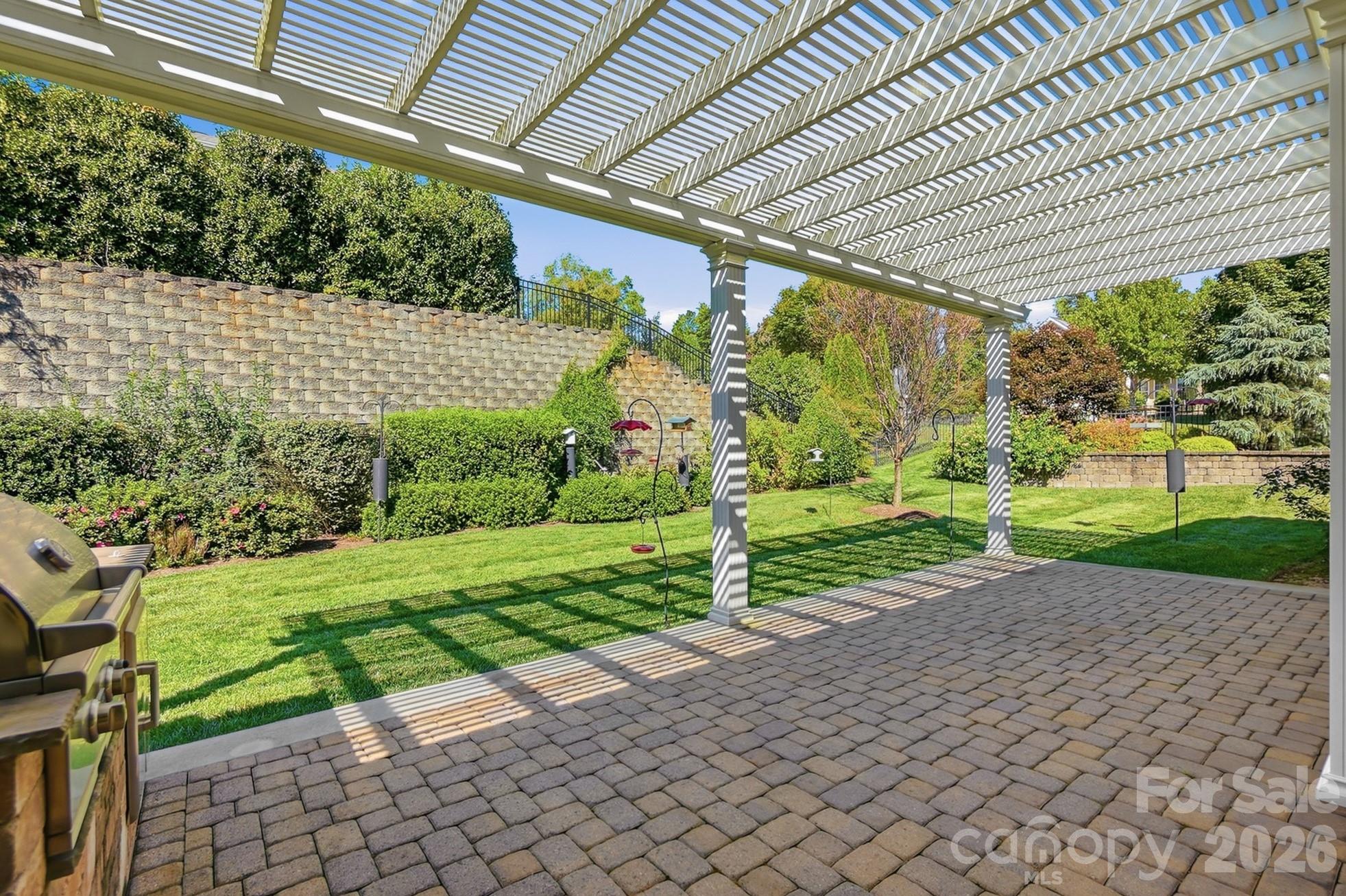 Covered patio is perfect for entertaining or relaxing and enjoying the outdoors - 9106 Longvale Lane, Charlotte
