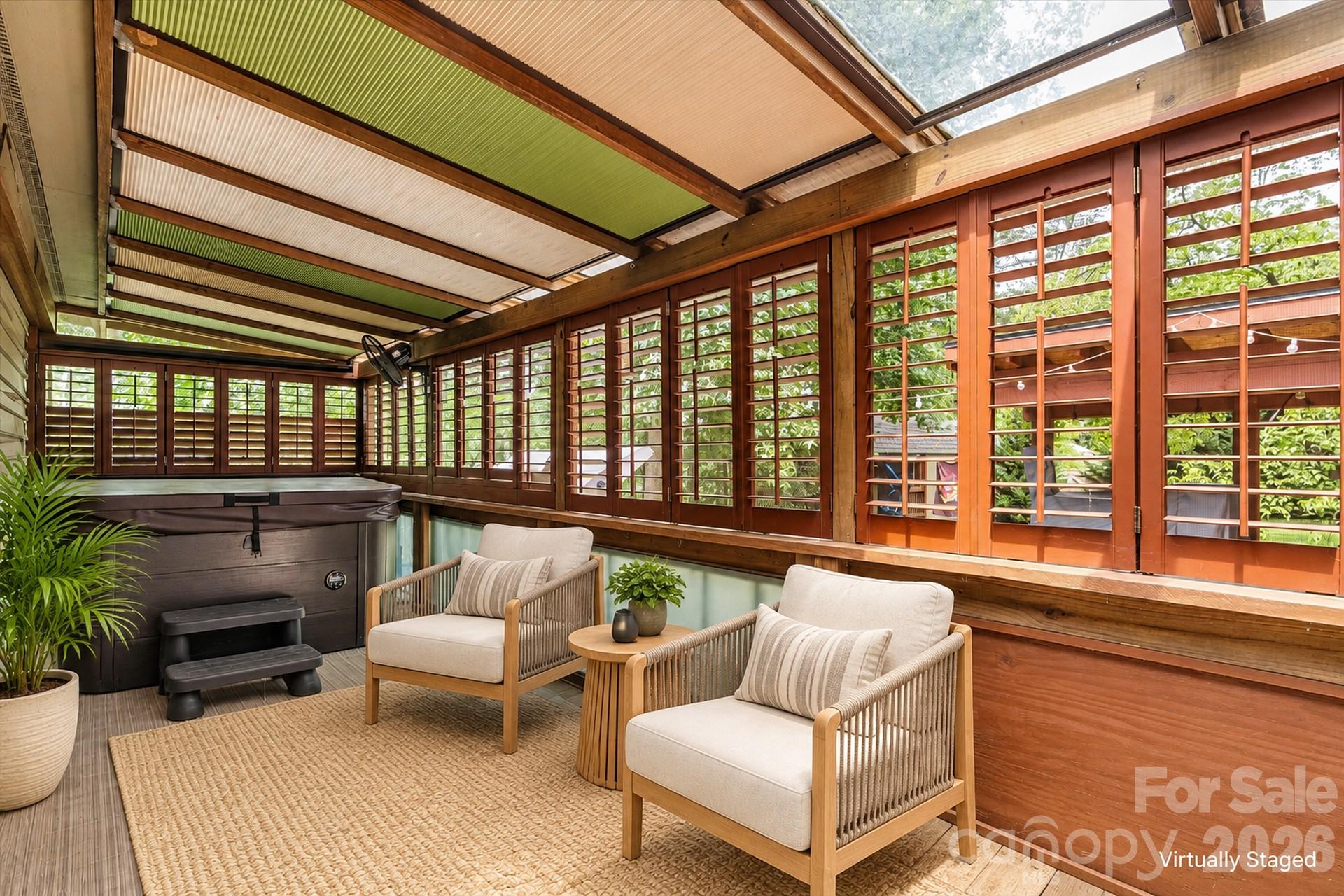 Screened deck with hot tub. Virtually Staged 7697 Katherine Drive - 7697 Katherine Drive, Denver