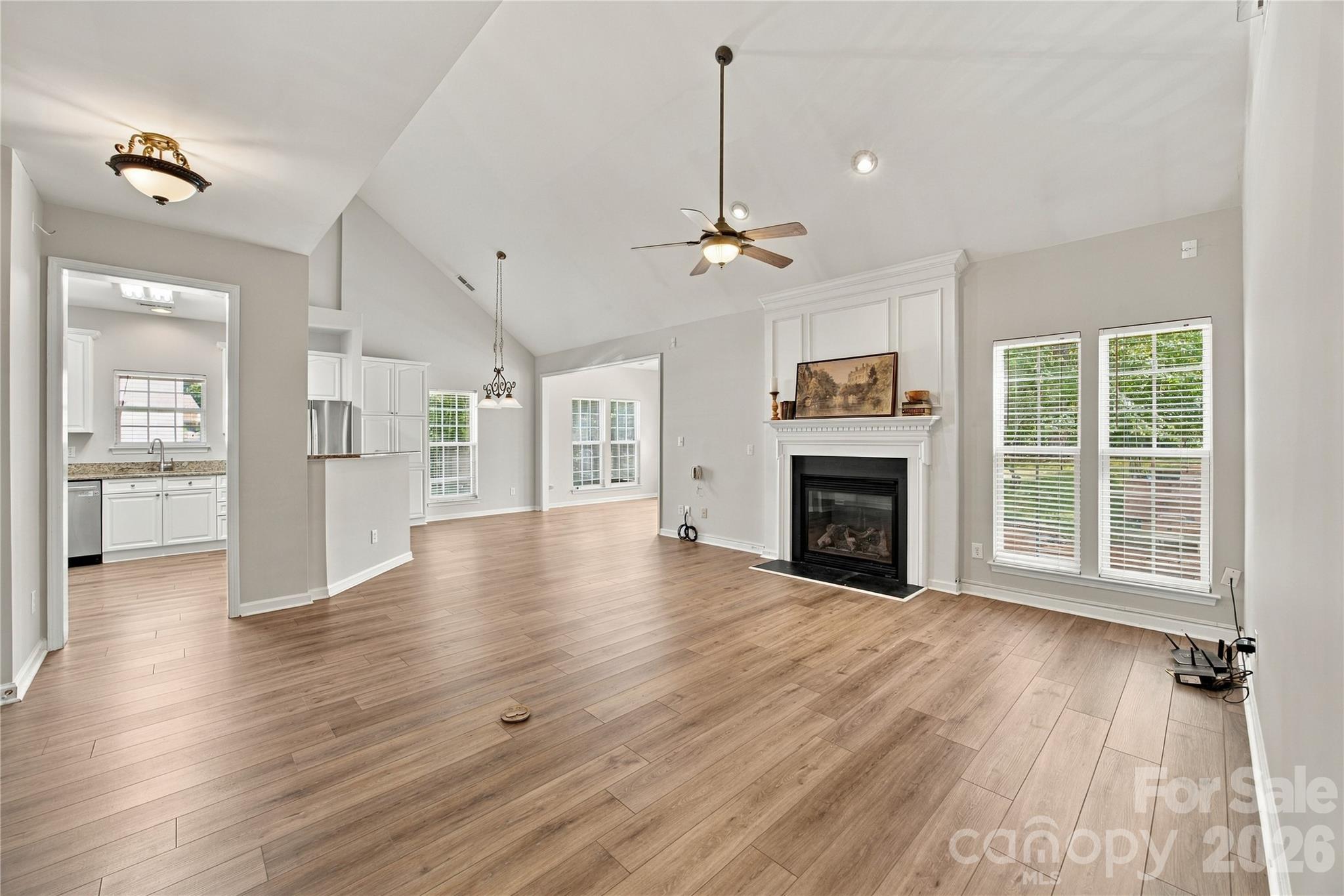 Newer LVP flooring throughout the downstairs - 195 Huntly Lane, Mooresville