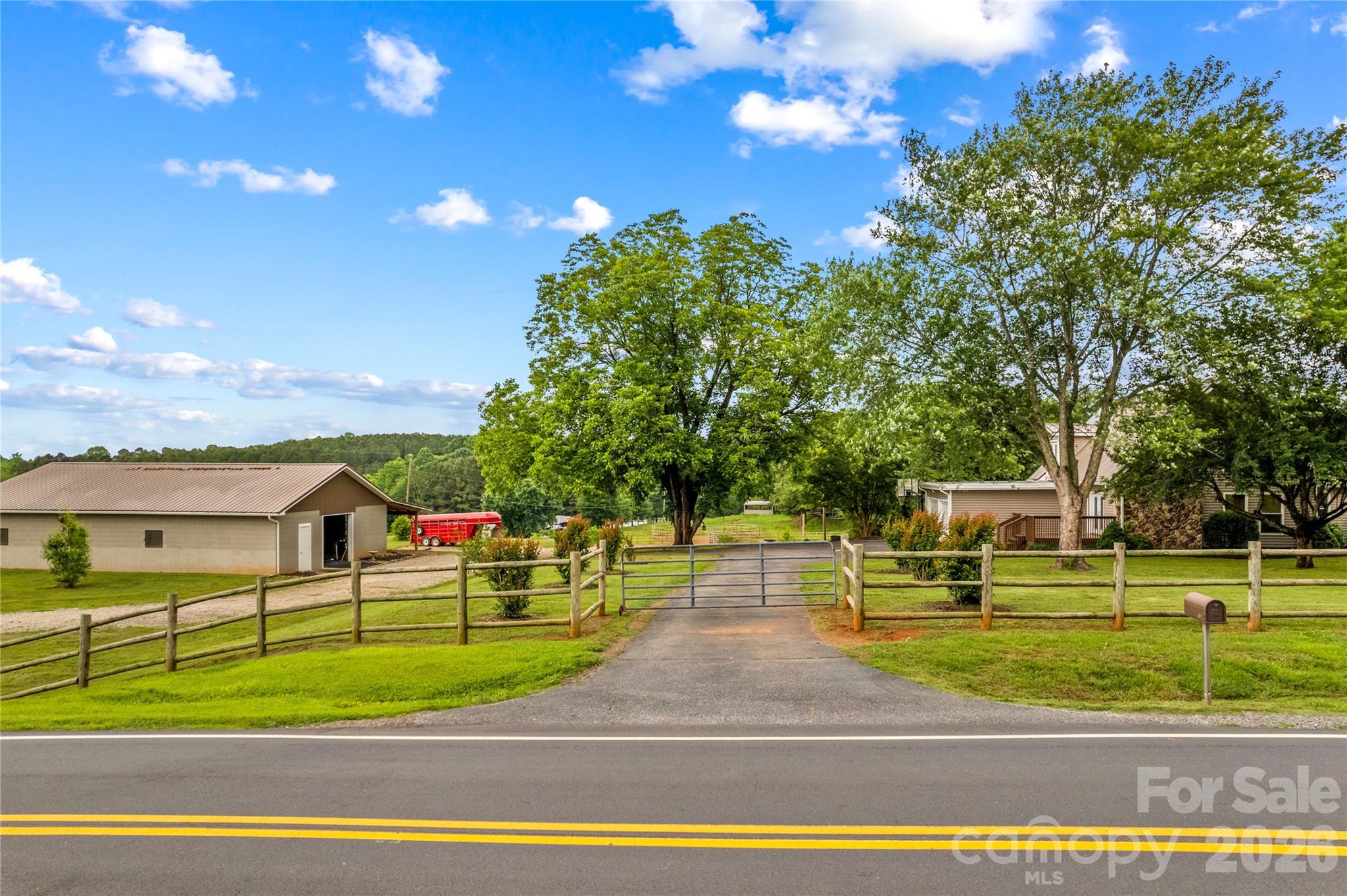 Gated Entrance. The Home and Acreage is fully Fenced - 296 Hicks Creek Road, Troutman