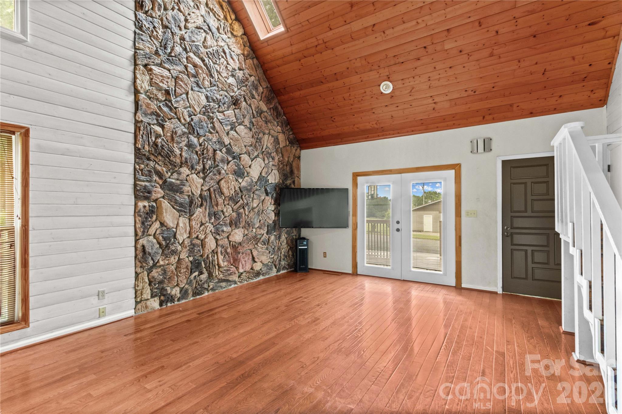 Stone Accent Wall and Vaulted Great Room - 296 Hicks Creek Road, Troutman