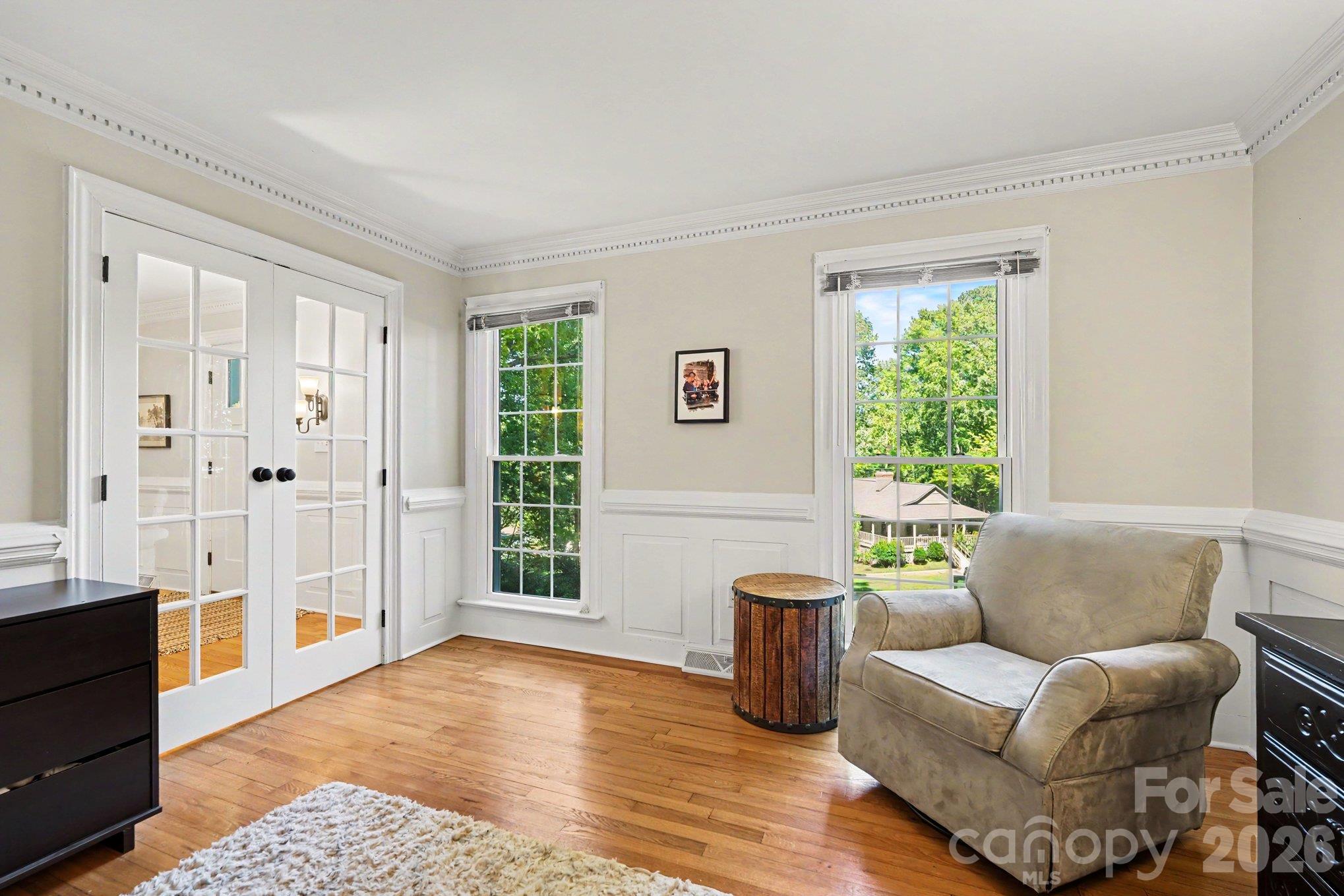 French doors, elegant millwork, and abundant natural light create a welcoming space for a home office or guest suite. - 607 Anderson Avenue, Salisbury
