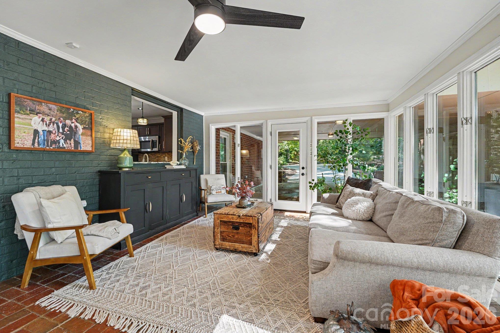 The sunroom offers convenient access to the carport, creating an easy connection between indoor and outdoor spaces - 607 Anderson Avenue, Salisbury