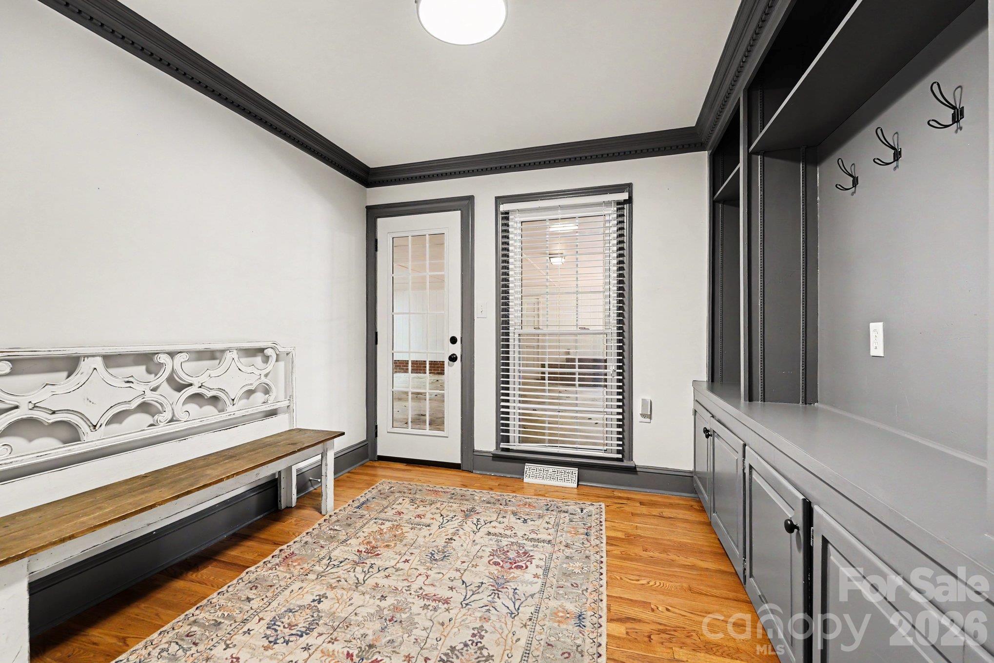 Built in cubbies, coat hooks, and concealed storage keep everyday essentials neatly organized in this thoughtfully designed mudroom - 607 Anderson Avenue, Salisbury
