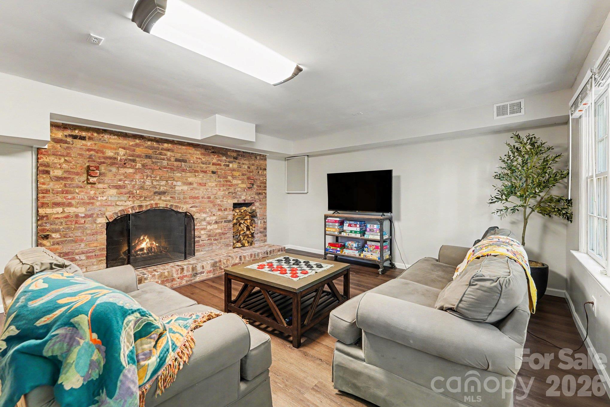 Stunning brick fireplace in the basement perfect for those cozy nights - 607 Anderson Avenue, Salisbury