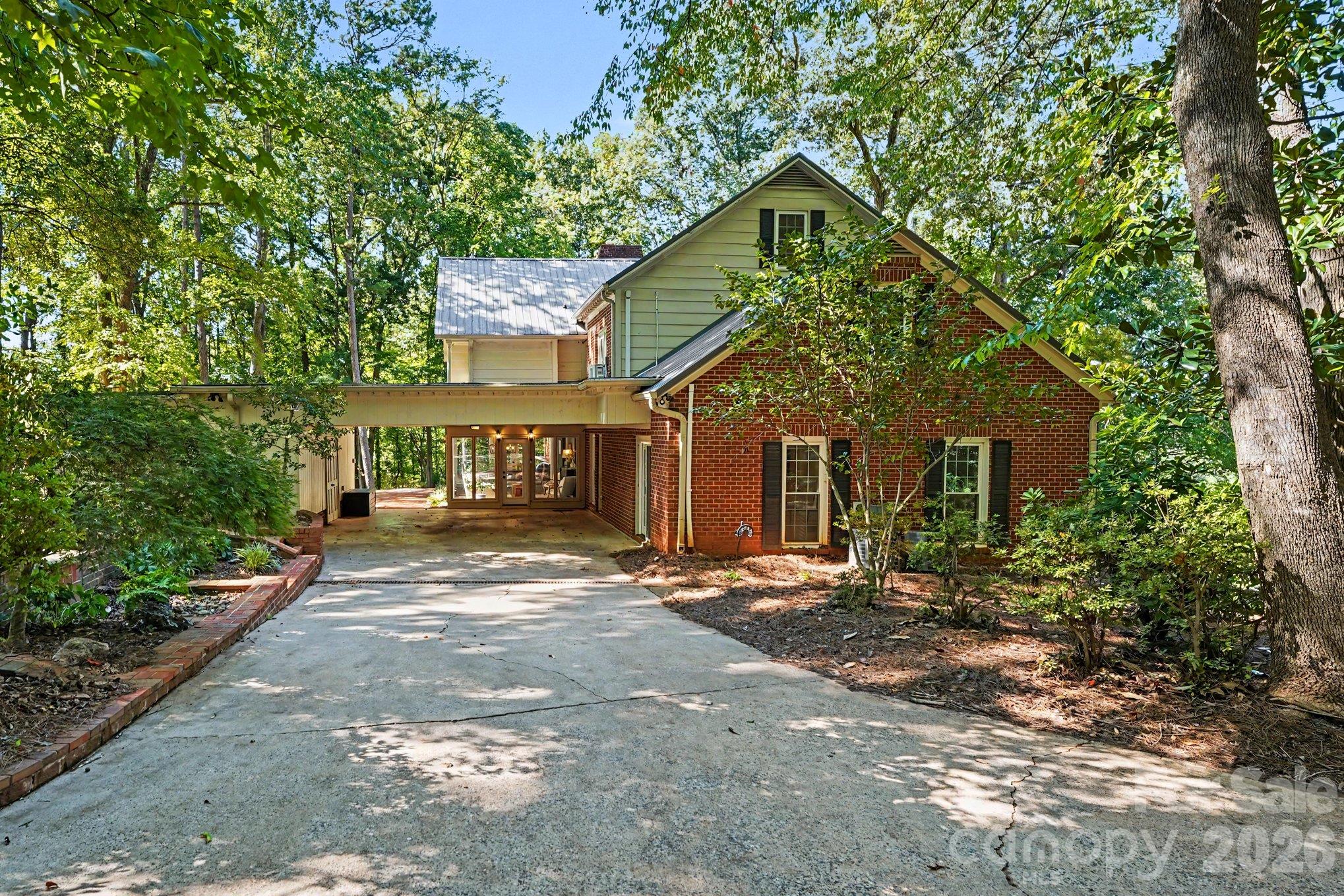 A spacious driveway and attached carport with storage - 607 Anderson Avenue, Salisbury