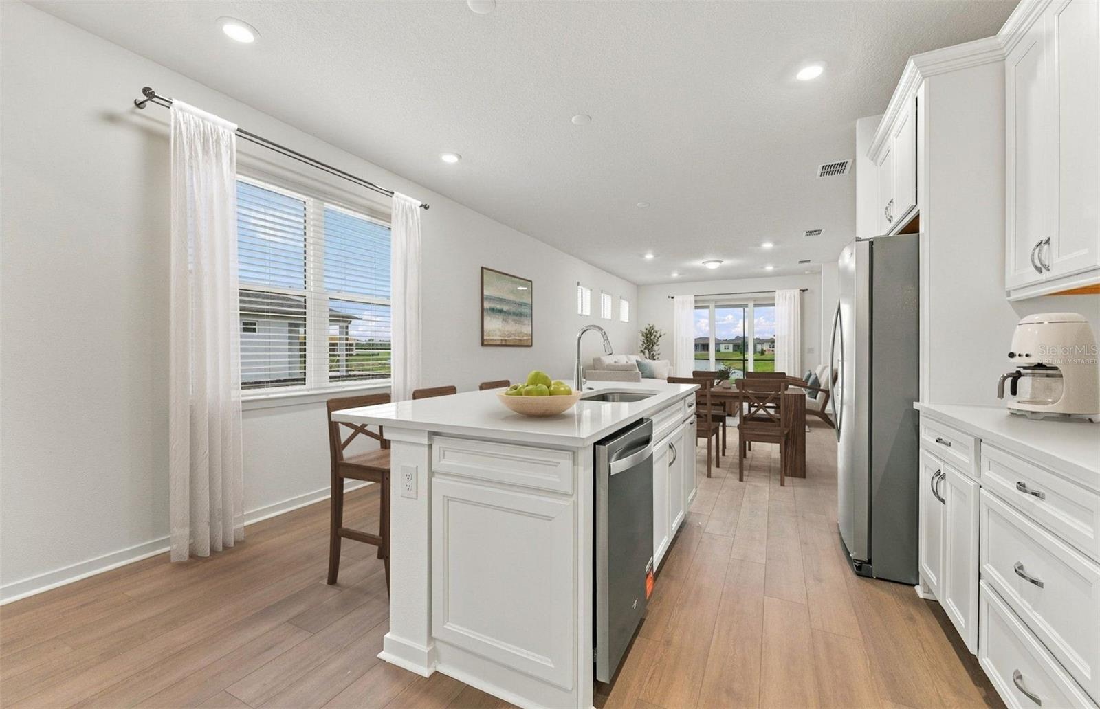 Virtually Staged - Open Kitchen to Cafe to Gathering Room - 15029 SUNBEAM ST, PARRISH