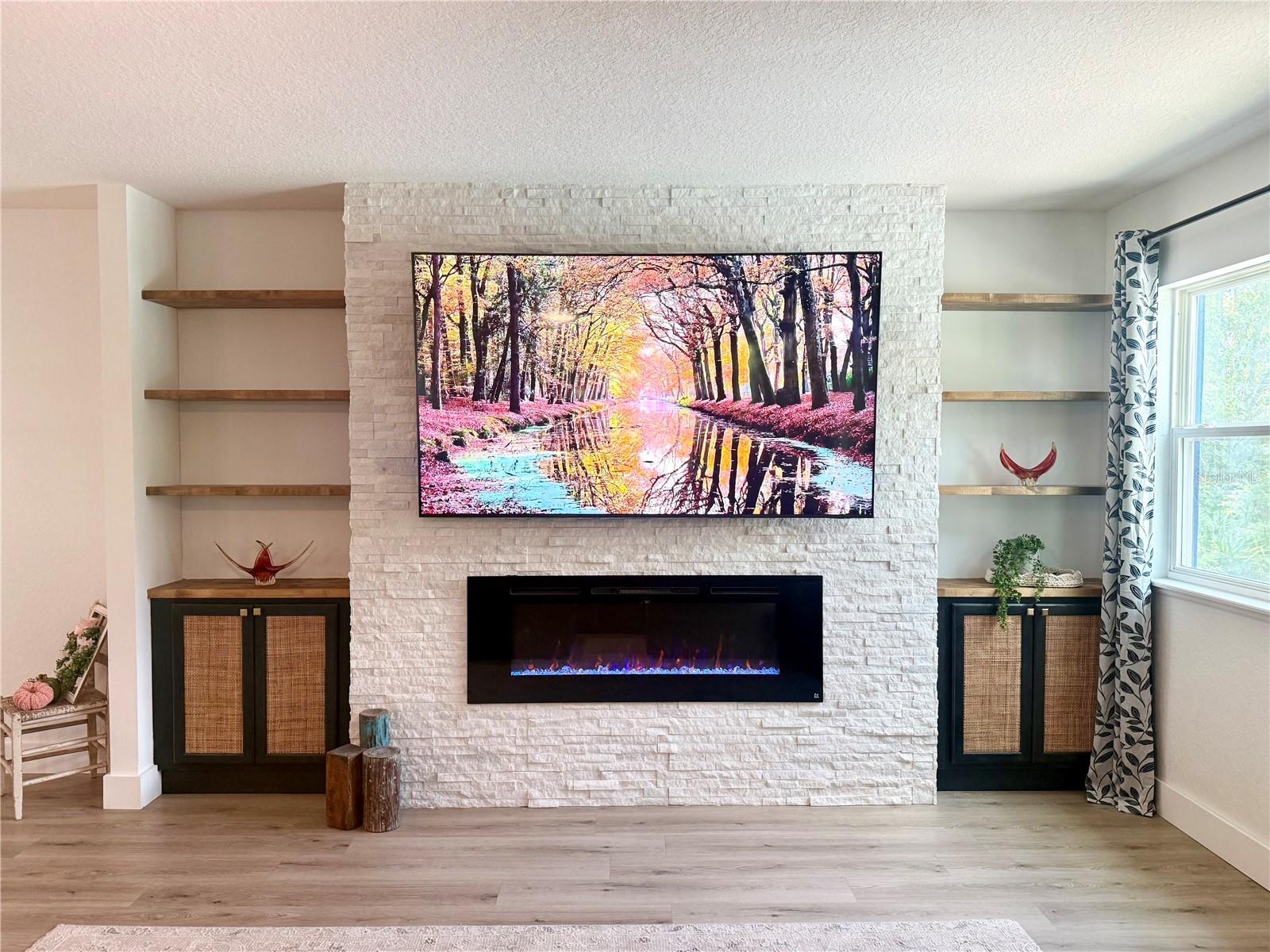 Feature wall with fireplace and built-ins - 9219 CANNA ST, PORT CHARLOTTE