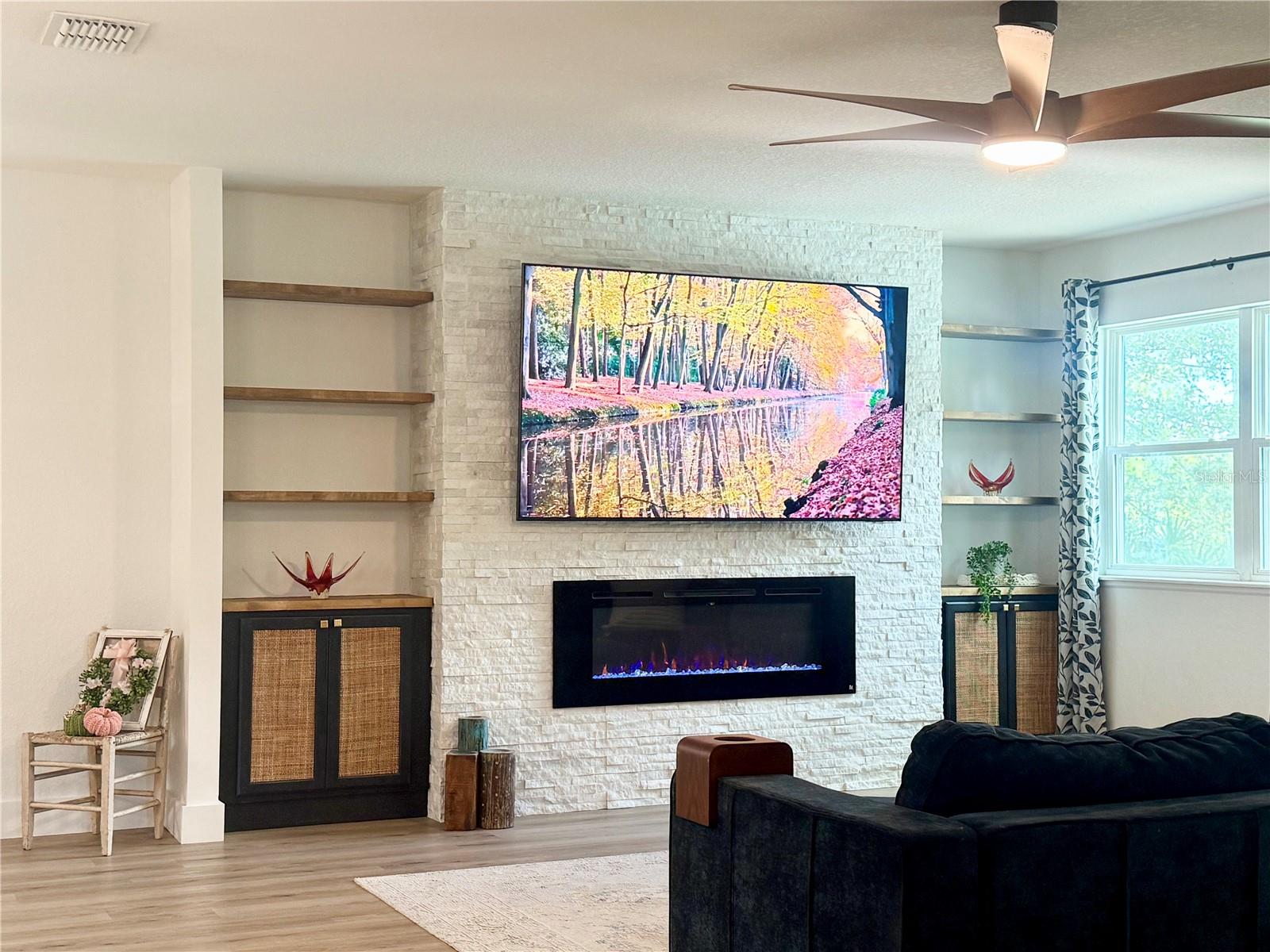 Feature wall with fireplace and built-ins - 9219 CANNA ST, PORT CHARLOTTE