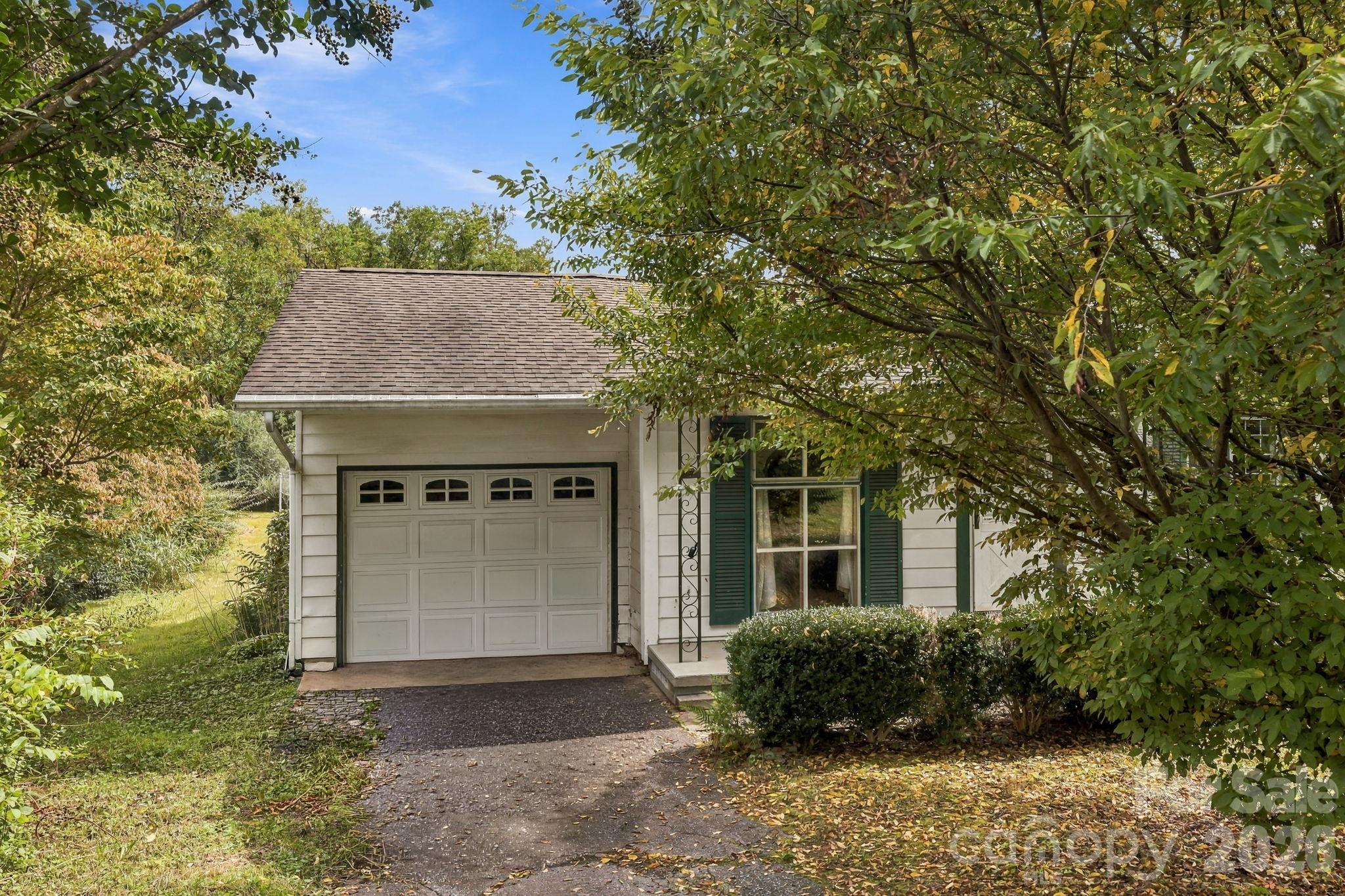 One-car attached garage and paved driveway - 648 Crystal Drive - 648 Crystal Drive, Hendersonville