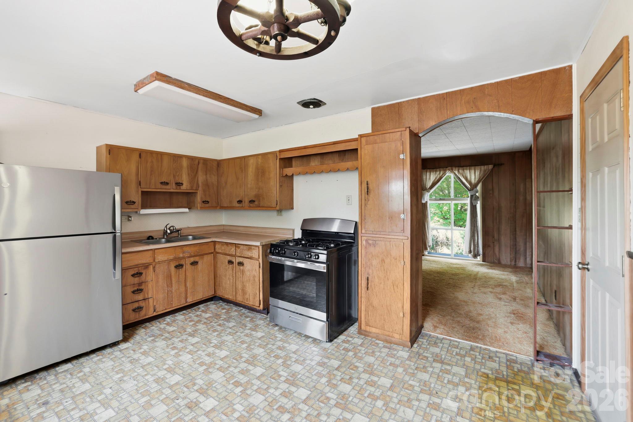 Kitchen, looking towards Living Room.  Door on right is to the garage - 648 Crystal Drive - 648 Crystal Drive, Hendersonville