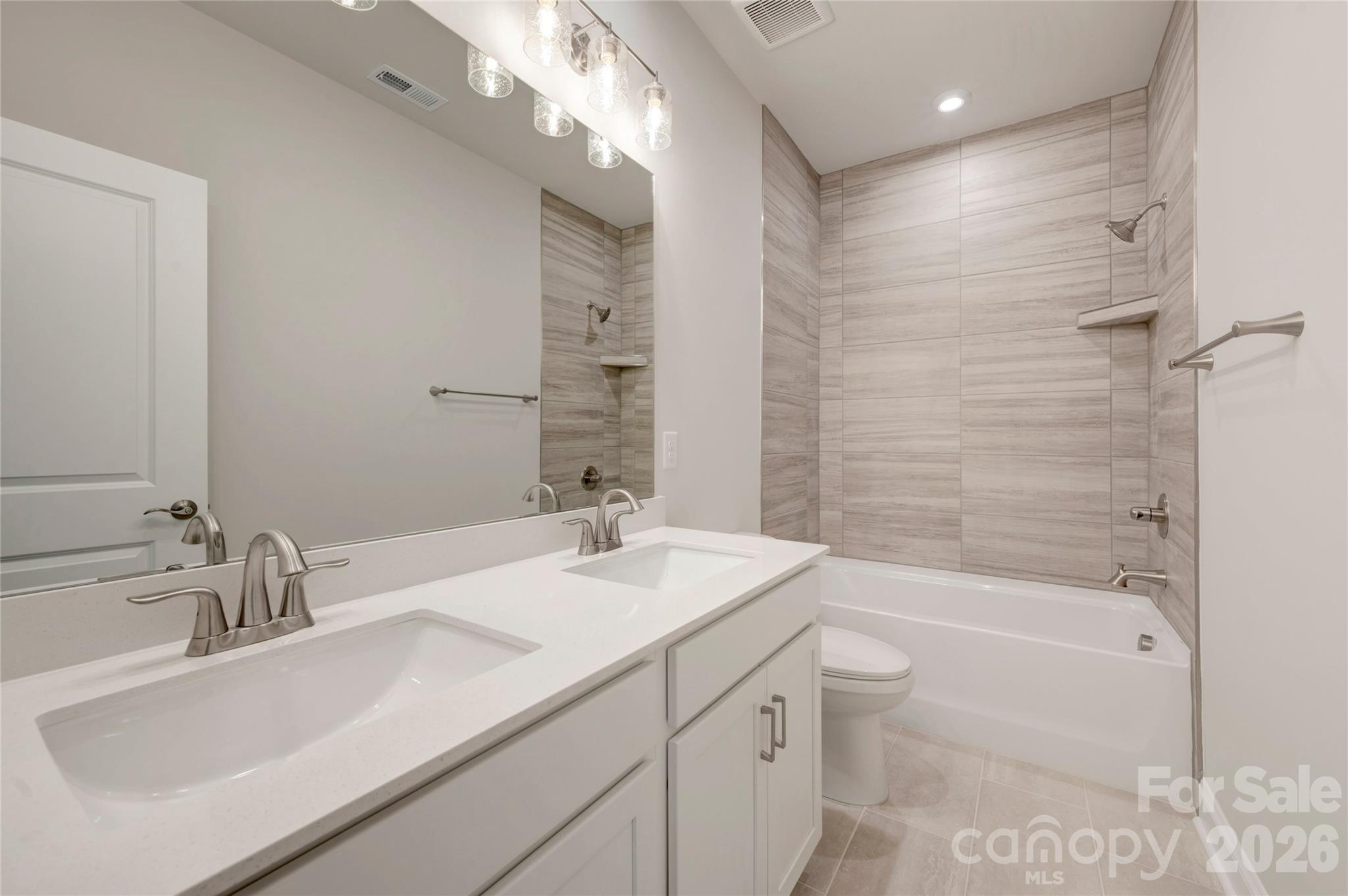 Secondary bathroom with tiled walls above the tub - 201 Landy Street, Fort Mill