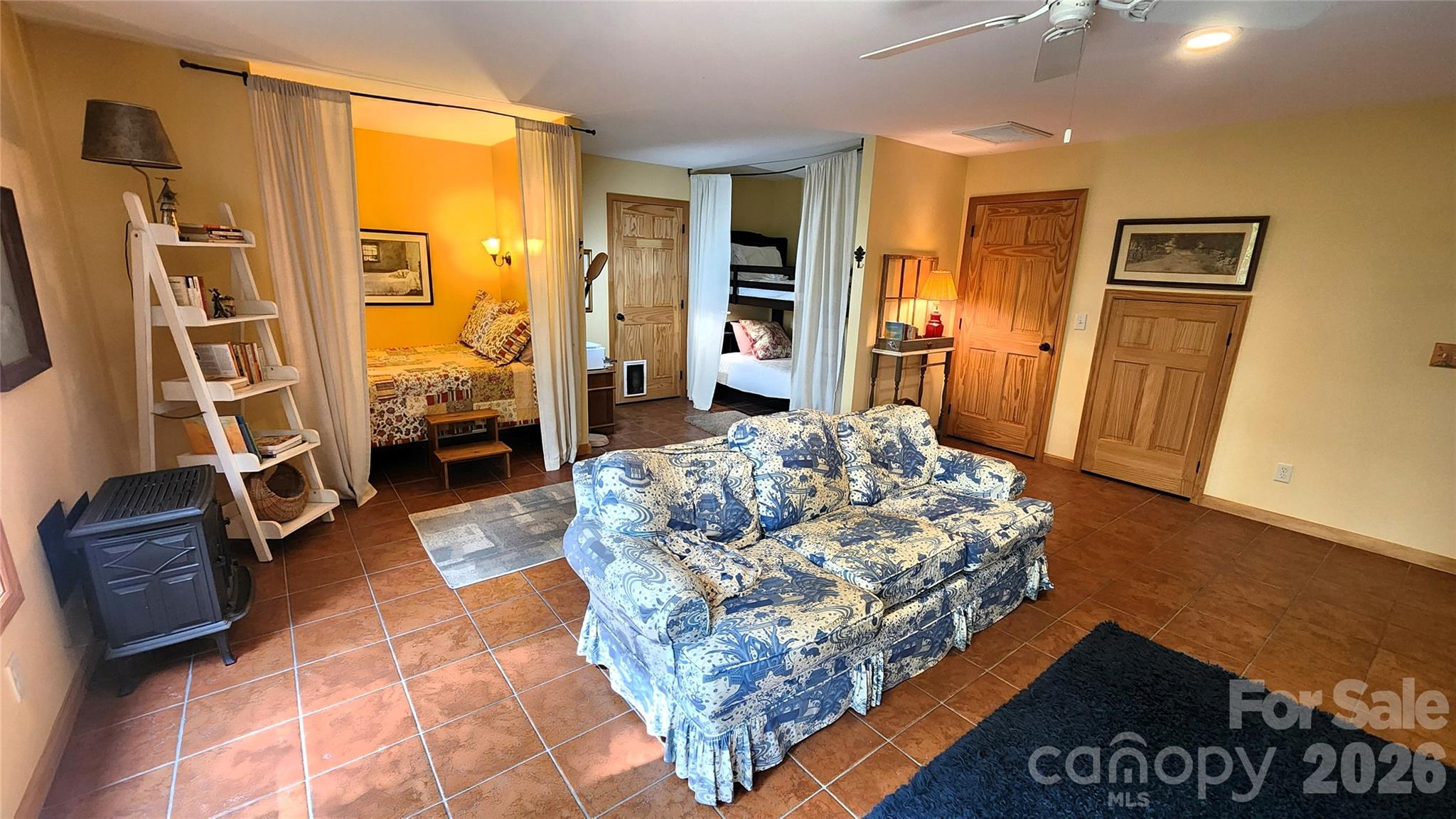 In addition to the downstairs bedroom, there are two sleeping nooks. Make one into an office! - 115 Laurel Wood Drive, Mars Hill