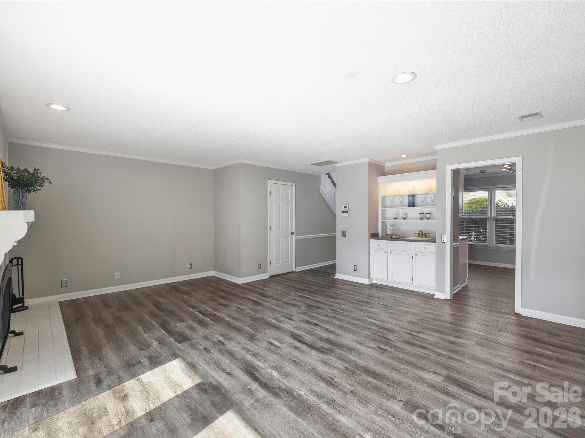 Living Room with Door to Powder Room - 7243 Meeting Street, Charlotte