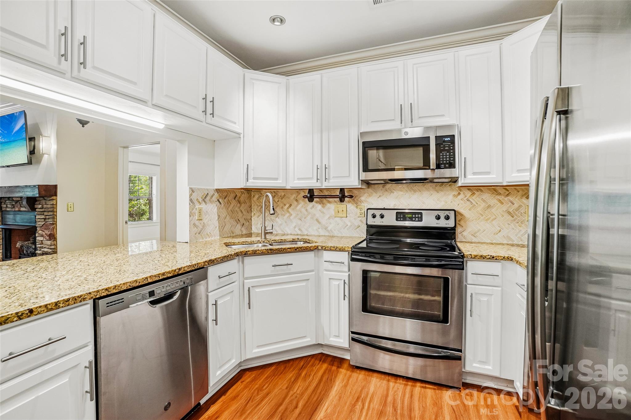 Kitchen upgrades include cabinets, granite countertops, tile backsplash, and appliances. - 9 Kenilworth Knolls, Asheville