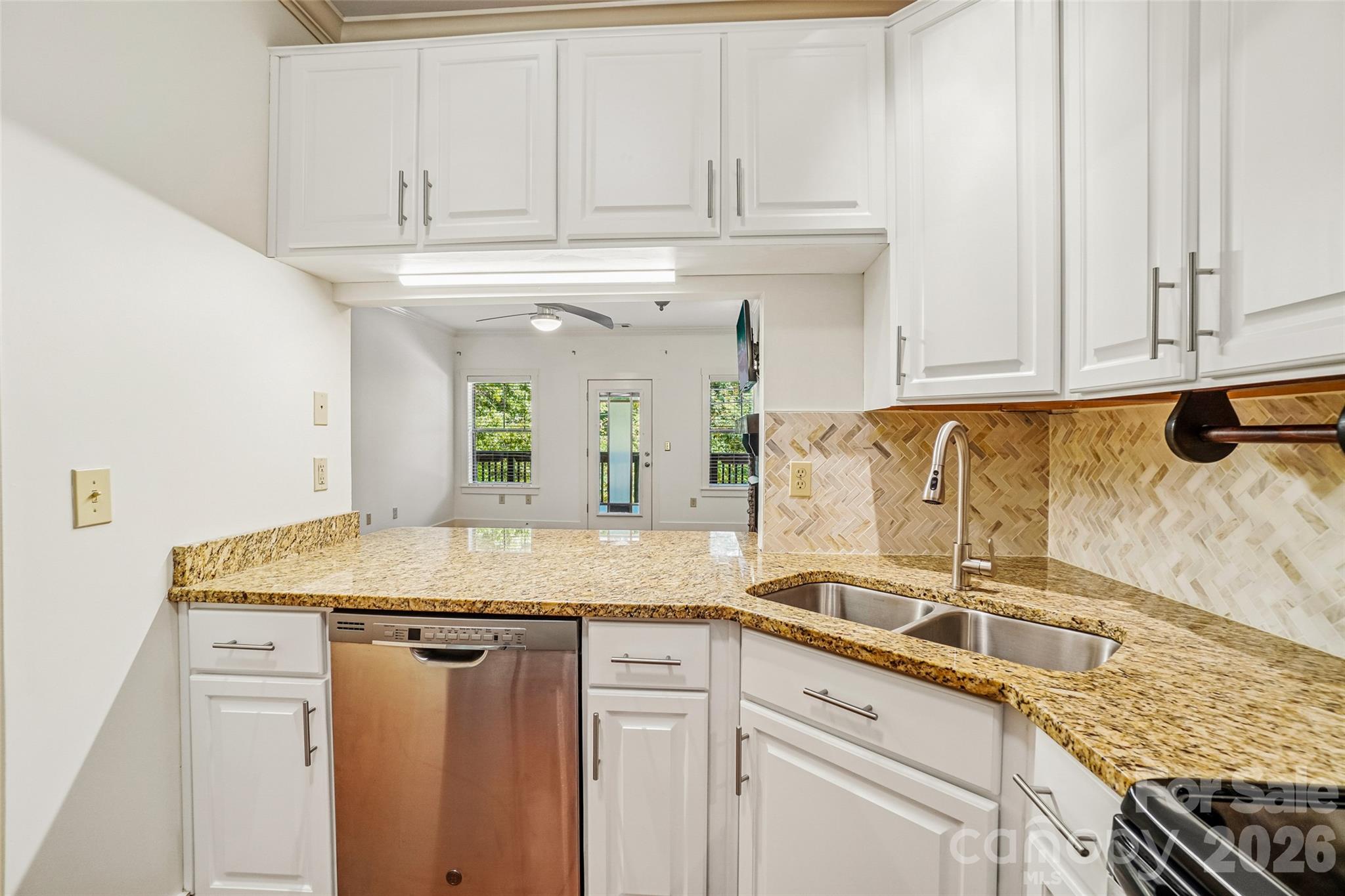 Watch TV through the pass-through while prepping and cooking. - 9 Kenilworth Knolls, Asheville
