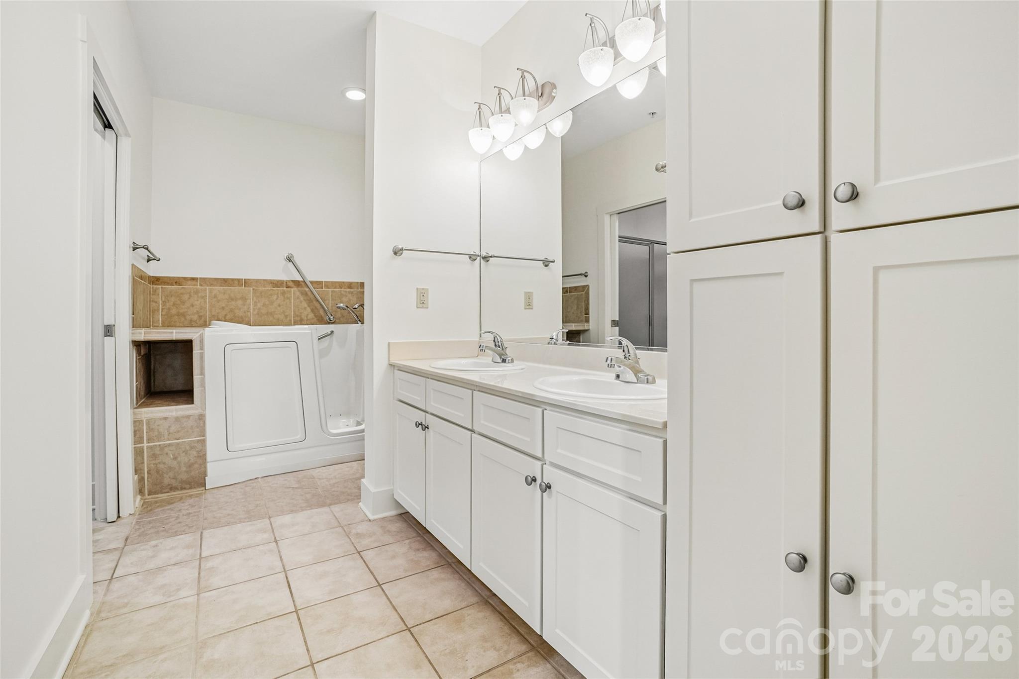 Primary bathroom with plenty of cabinet storage. - 9 Kenilworth Knolls, Asheville