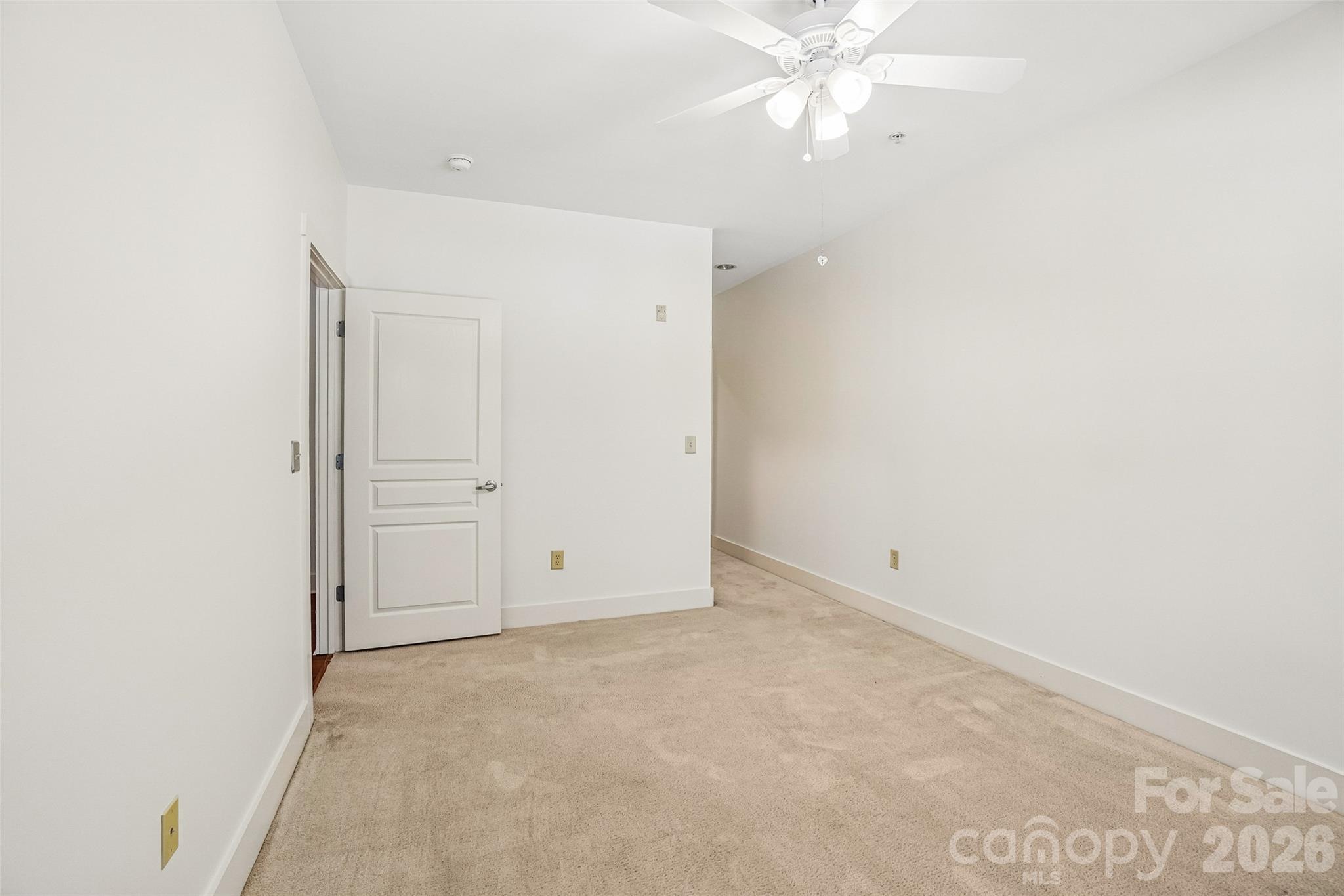 Second bedroom looking towards hallway to WIC and en-suite shower. - 9 Kenilworth Knolls, Asheville