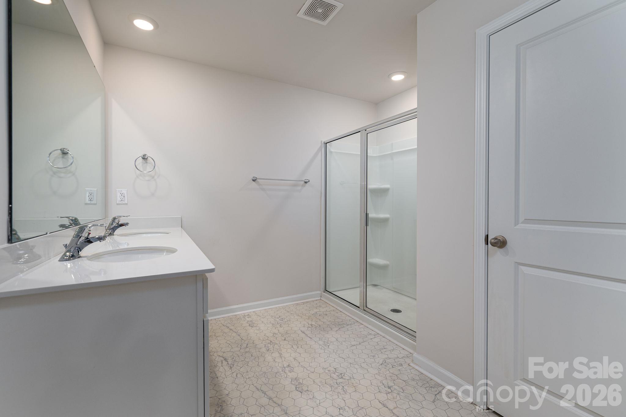 Primary Bathroom with double sink and separate toilet area - 1021 Foxberry Lane, Maiden