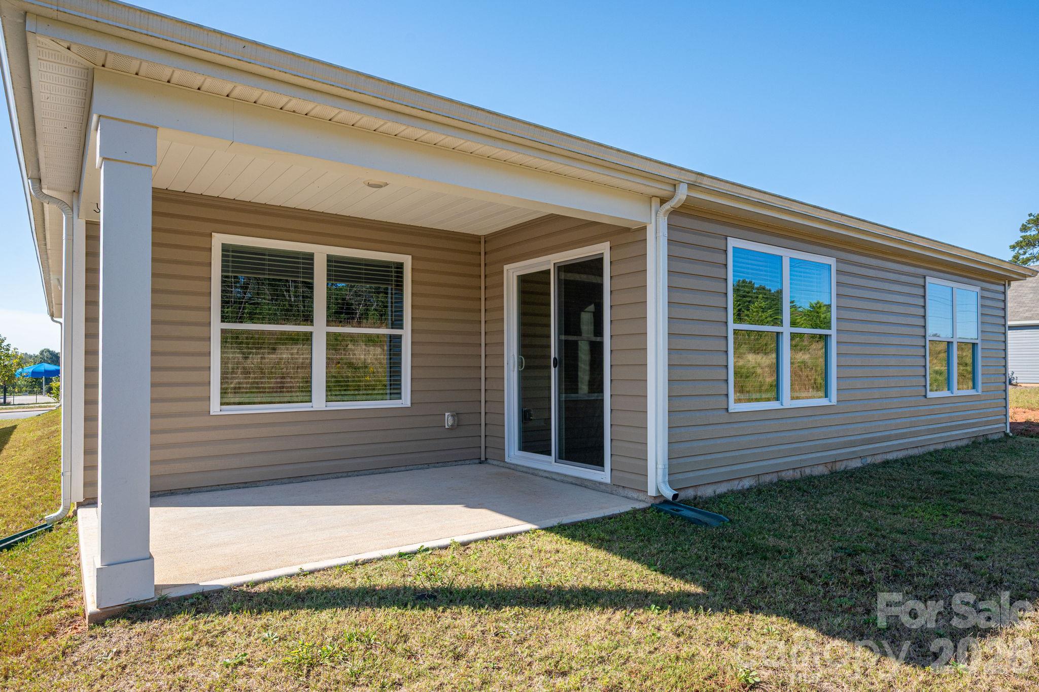 Back Patio with access to dining area through sliding doors - 1021 Foxberry Lane, Maiden