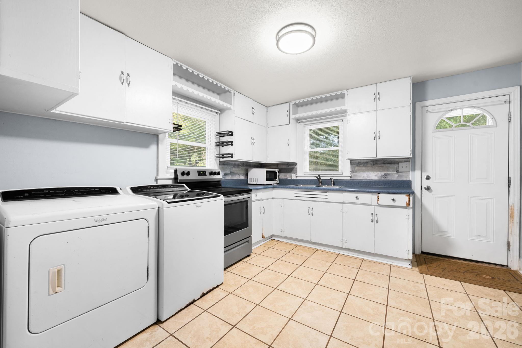 Kitchen with laundry - 6048 Sugar Loaf Road, Connelly Springs