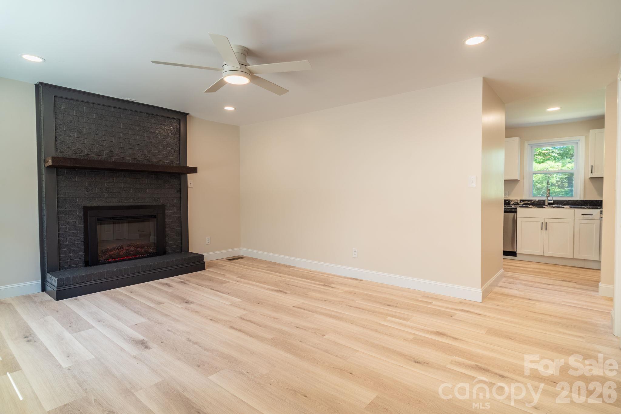 Living room to kitchen - 3078 Pax Hill Road, Morganton