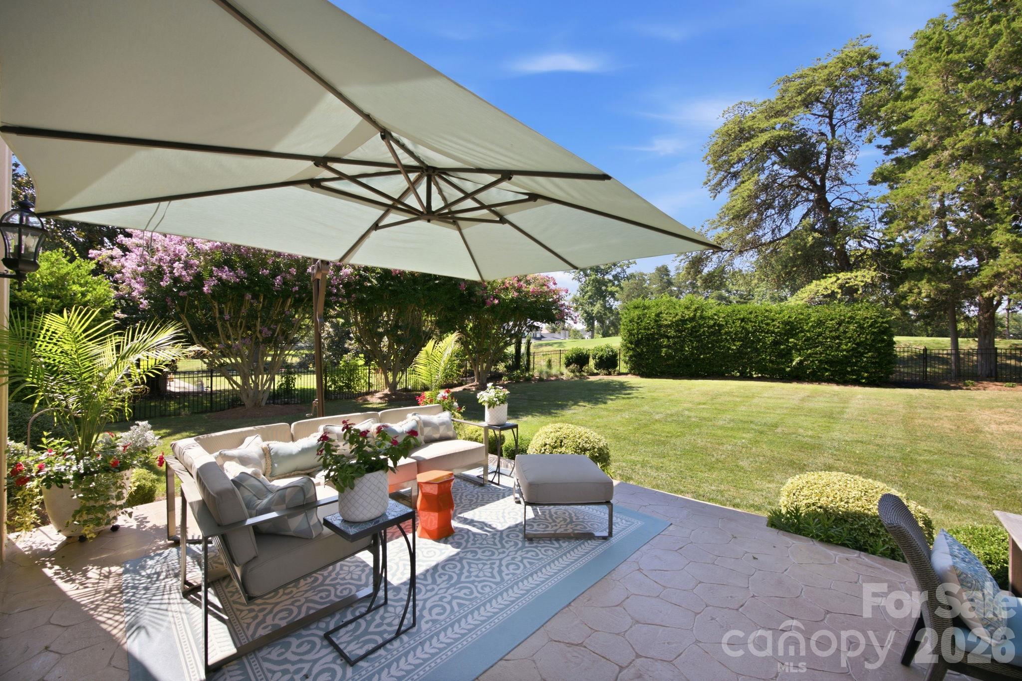 Step outside and envision your weekend gatherings on the private back patio. - 18416 Peninsula Club Drive, Cornelius