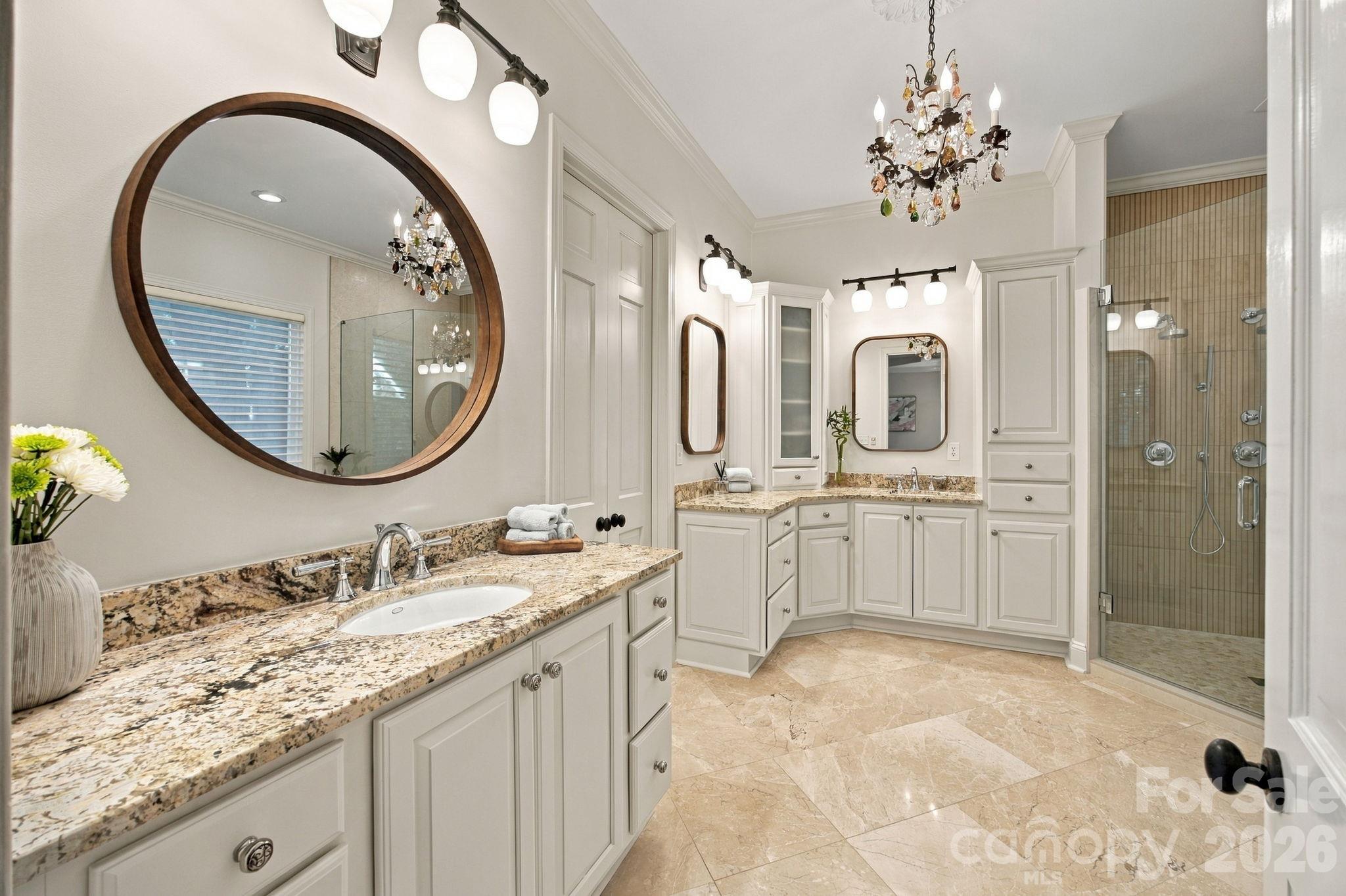 A beautifully appointed dual-vanity primary bathroom. - 18416 Peninsula Club Drive, Cornelius