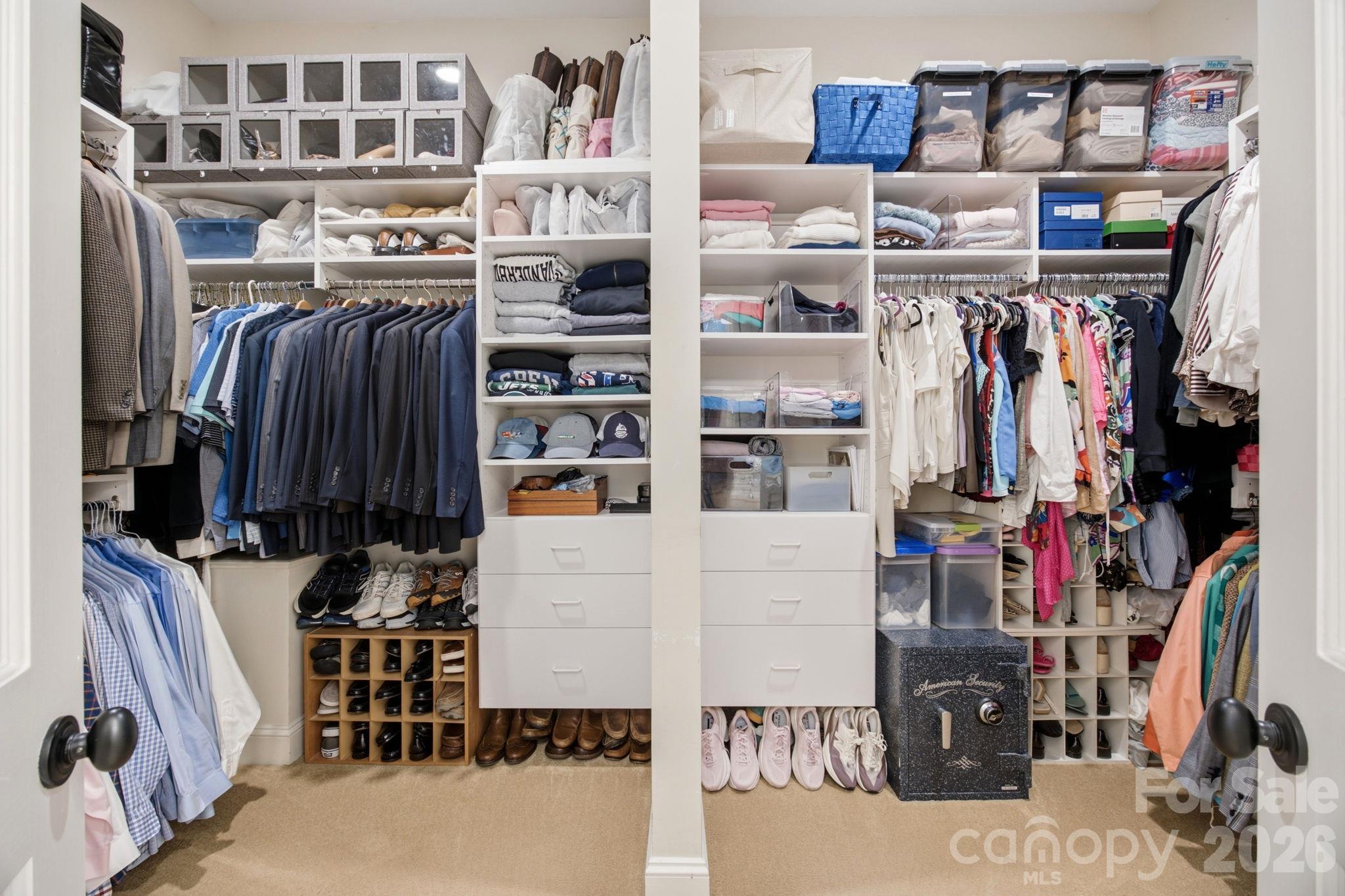 A massive walk-in custom closet designed to keep everything organized. - 18416 Peninsula Club Drive, Cornelius