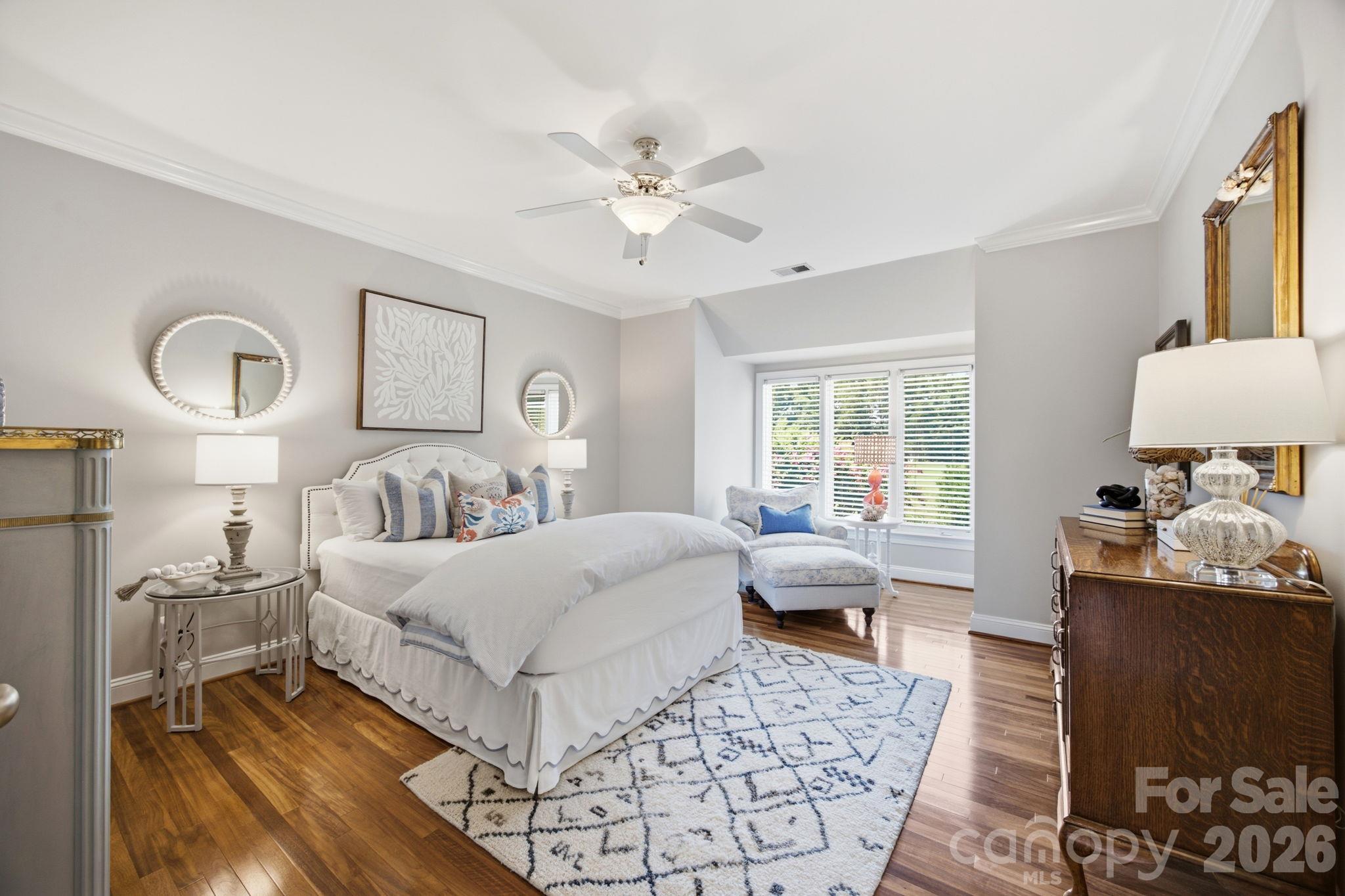 A comfortable secondary bedroom suite with lovely natural lighting. - 18416 Peninsula Club Drive, Cornelius