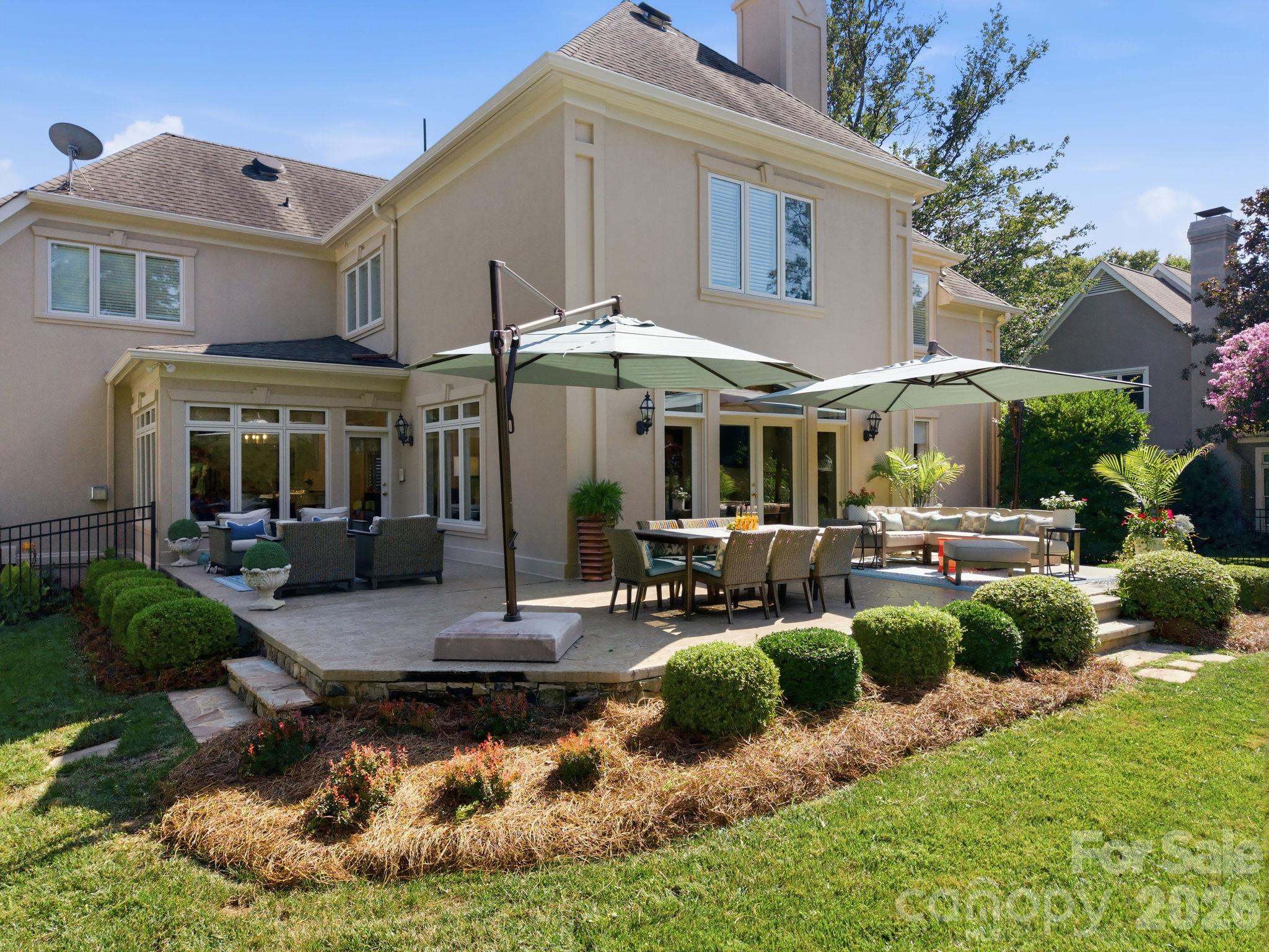 Step out onto your private patio, ideal for relaxing afternoons. - 18416 Peninsula Club Drive, Cornelius