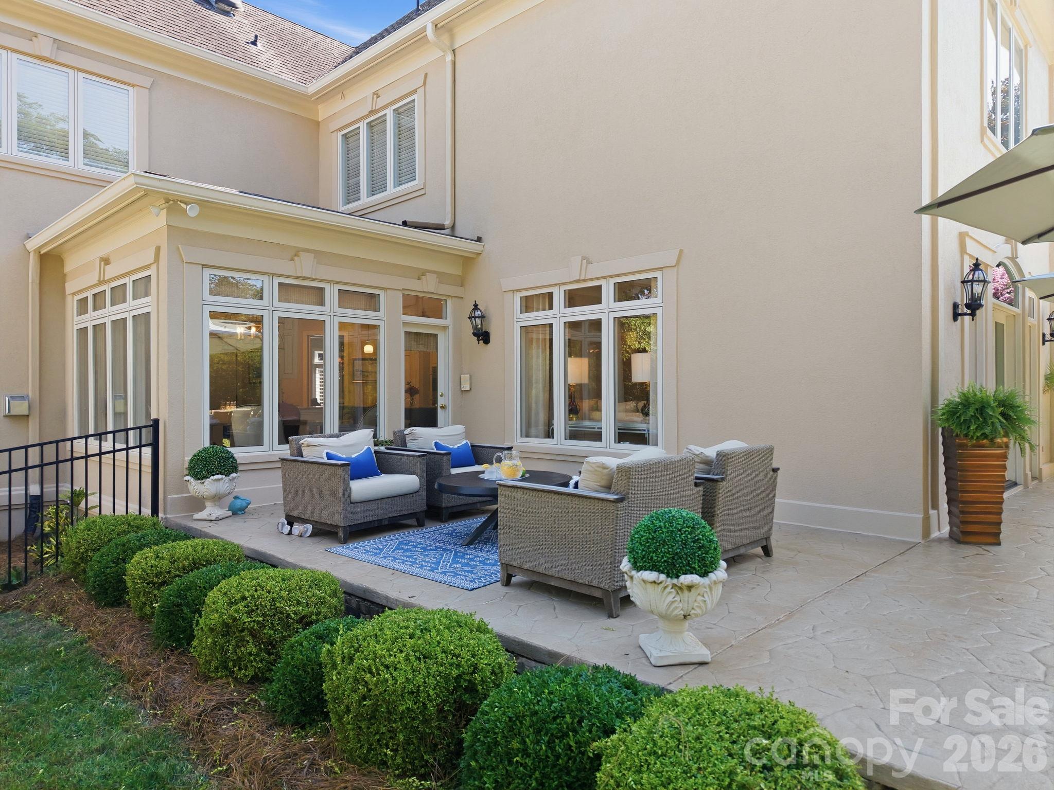 Expansive backyard green space with mature shade trees. - 18416 Peninsula Club Drive, Cornelius