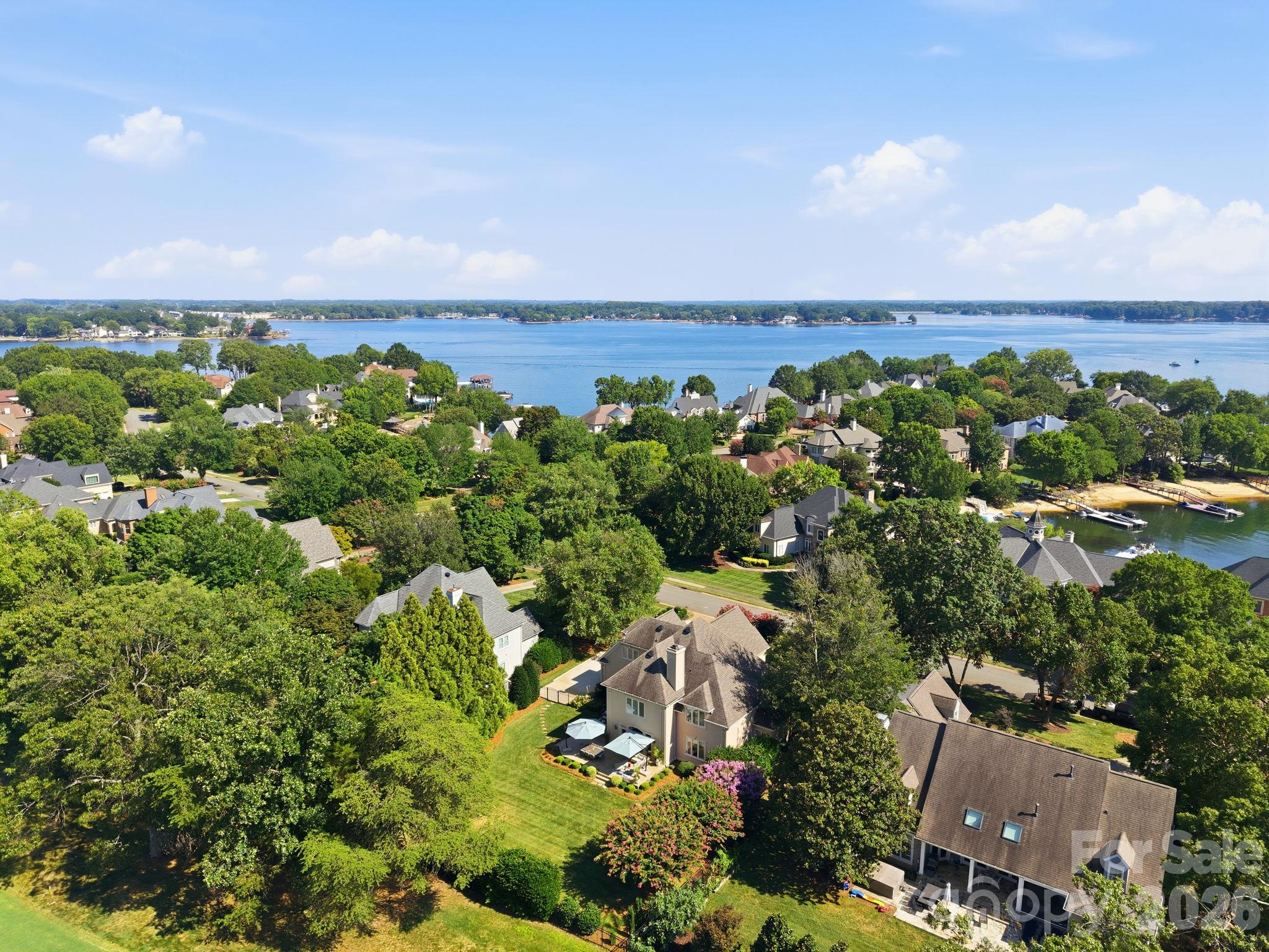 Expansive aerial overview highlighting the community's premier lakeside setting. - 18416 Peninsula Club Drive, Cornelius