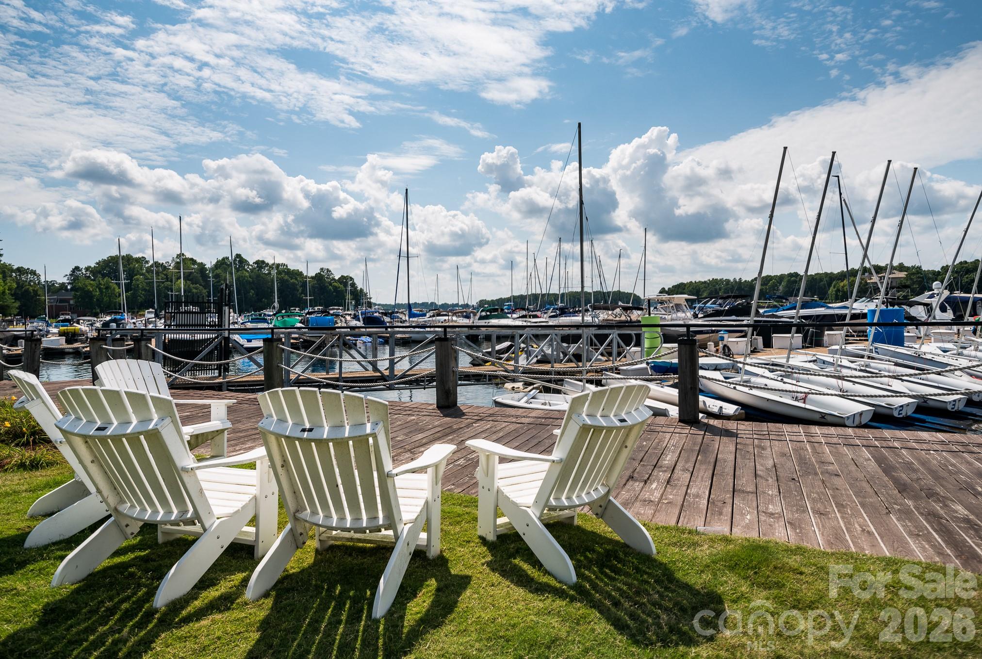 Unwind by the water at one of the neighborhood's peaceful lakeside sitting areas. - 18416 Peninsula Club Drive, Cornelius