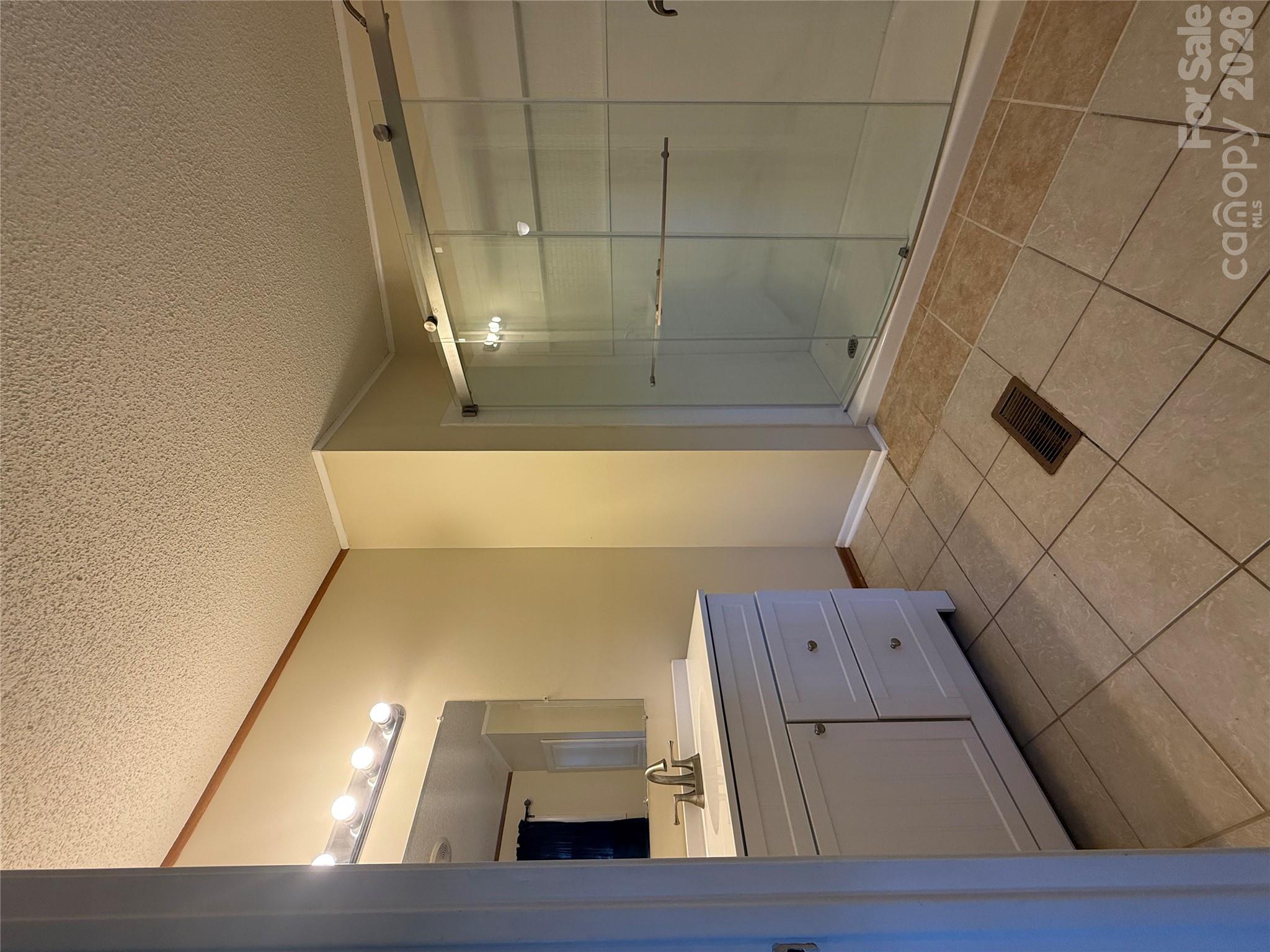 Primary bath with new vanity and walk in shower - 97 Fair Haven Drive, Burnsville