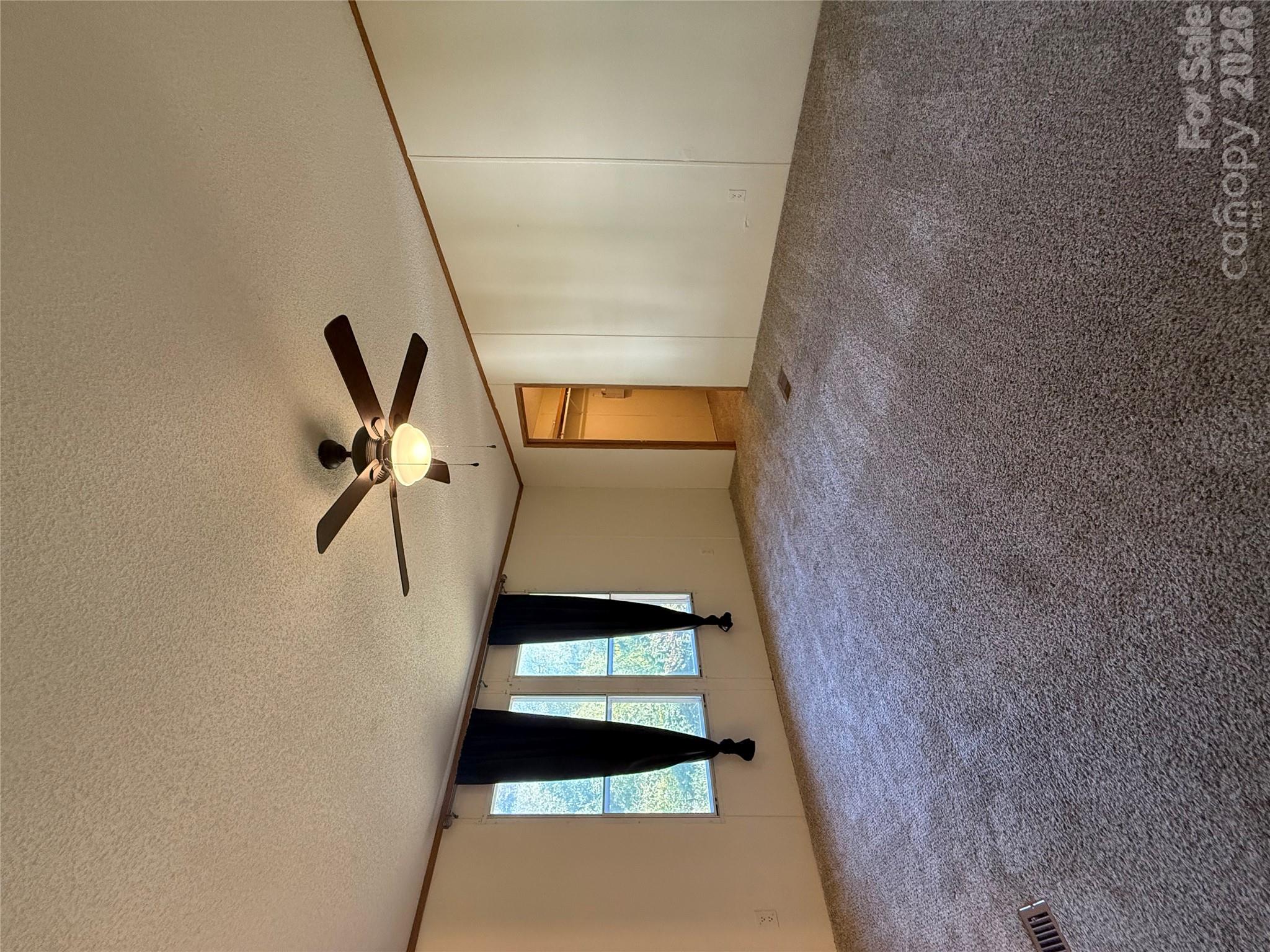 Primary bedroom with vaulted ceilings, large walk in closet and ensuite bath - 97 Fair Haven Drive, Burnsville