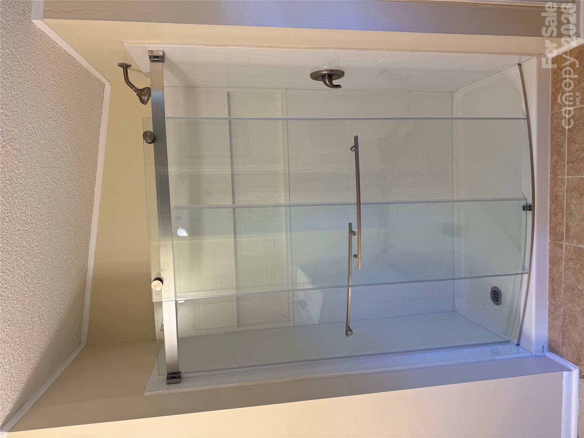 New walk in shower in primary bath - 97 Fair Haven Drive, Burnsville