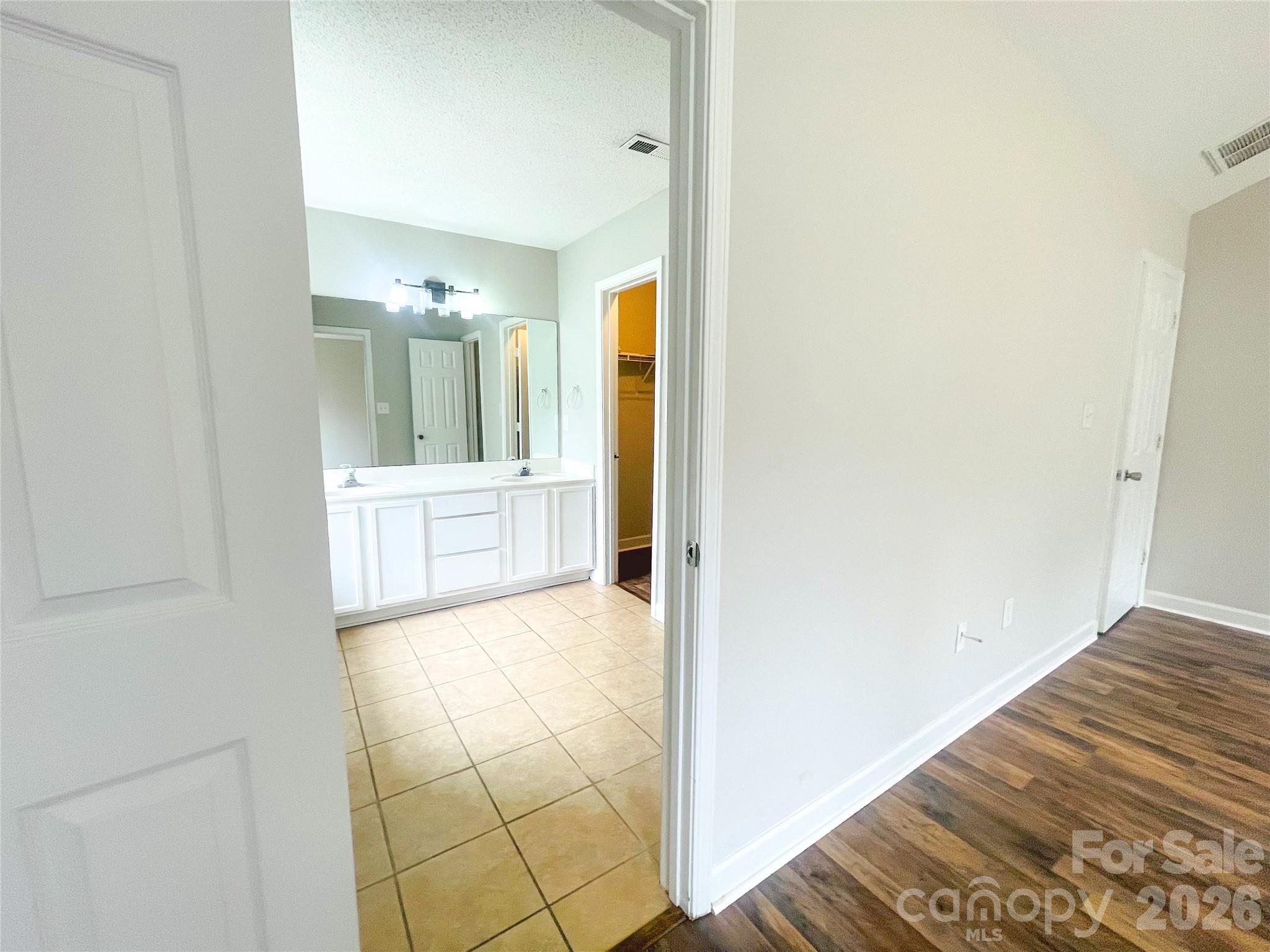 Primary bedroom into primary bathroom - 1011 Cadberry Court, Indian Trail