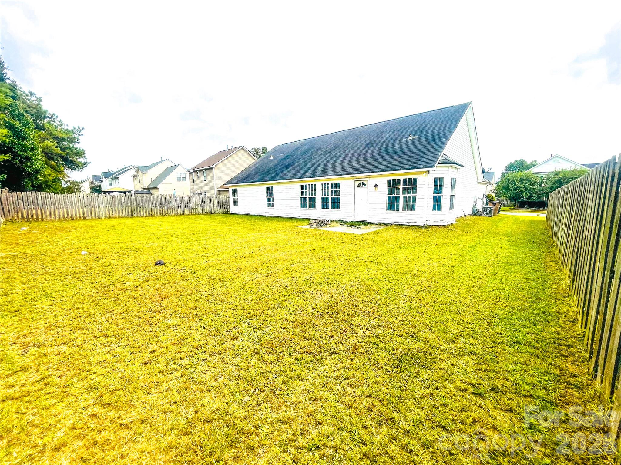 Spacious backyard from rear left - 1011 Cadberry Court, Indian Trail