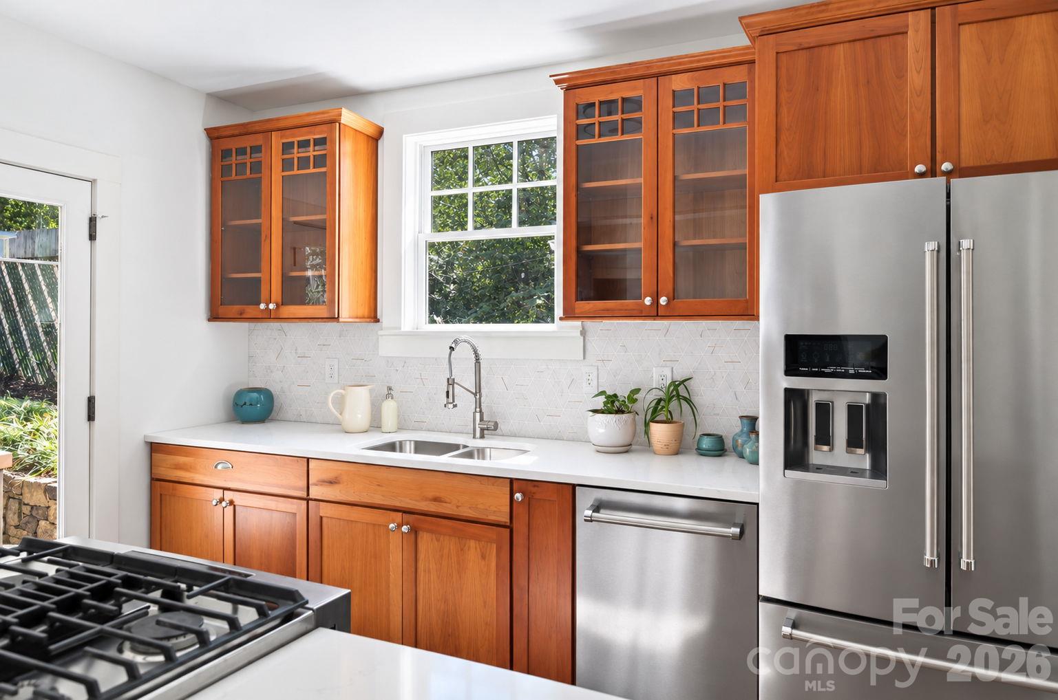 Refreshed Kitchen Features Calacatta Gold Quartzite and Stainless Steel - 133 Furman Avenue, Asheville