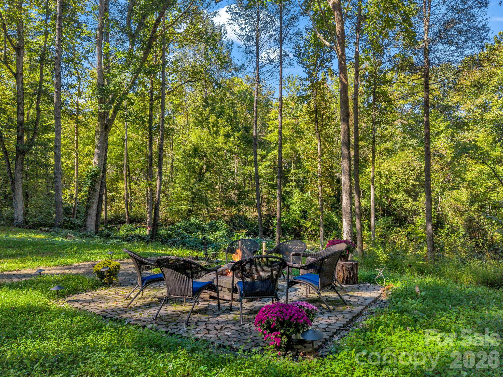 Fire pit view down to creek - 127 Cattail Road, Lake Lure