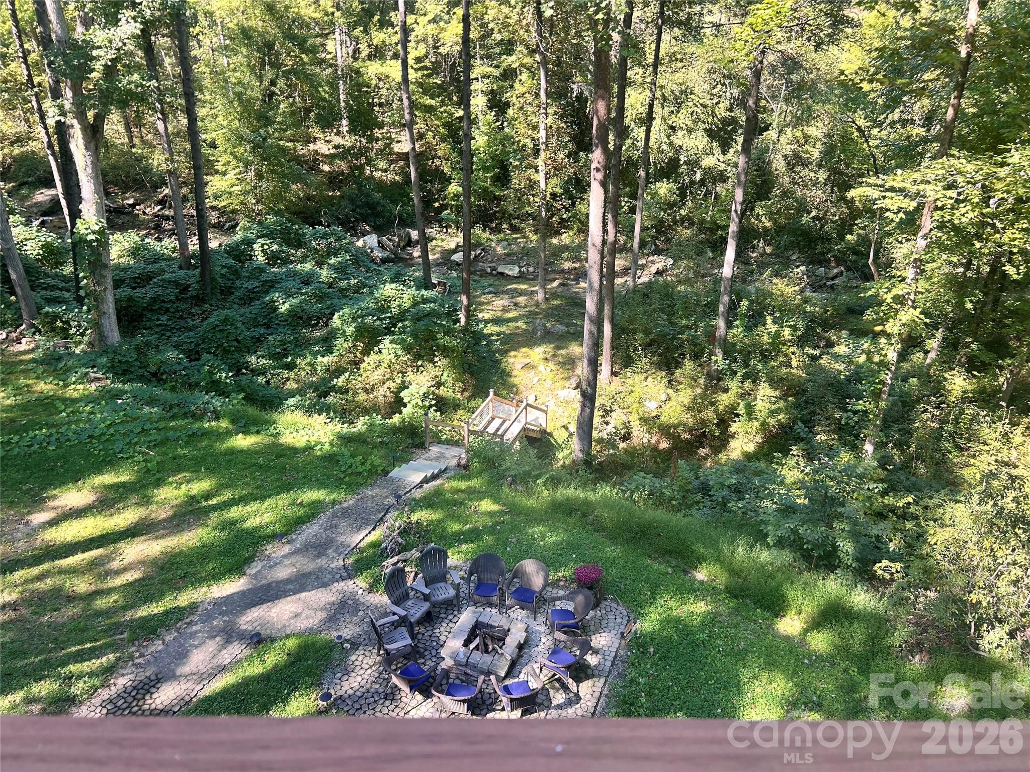 Top deck looking down to fire pit and creek - 127 Cattail Road, Lake Lure