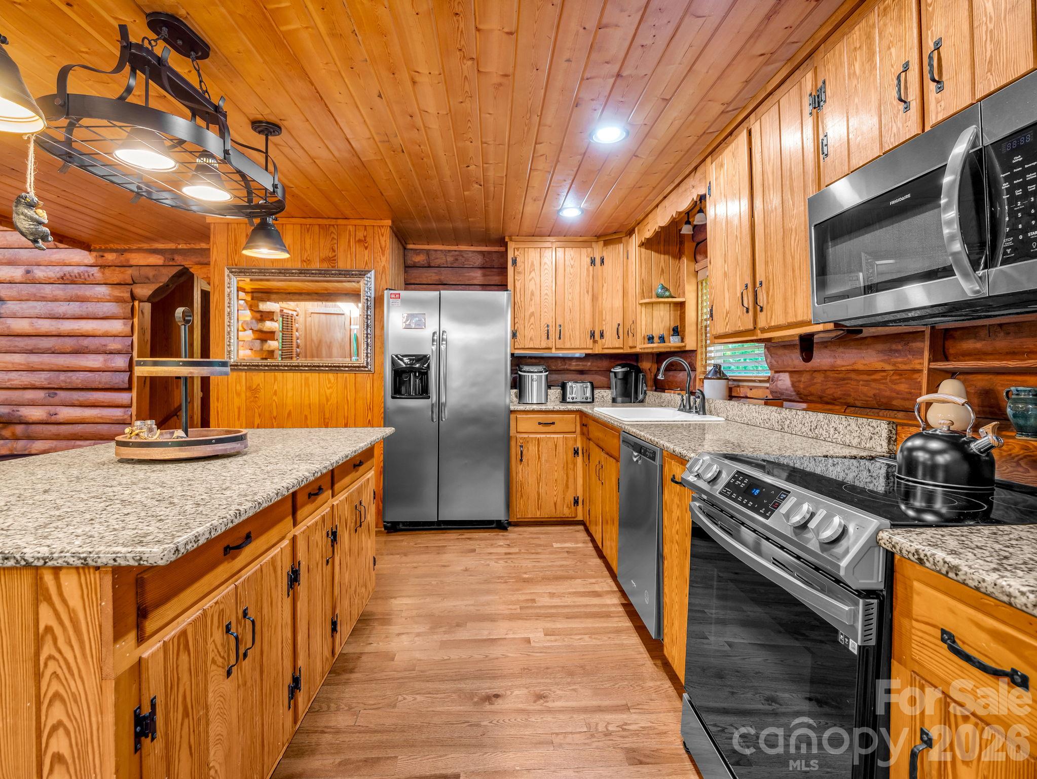 Kitchen with stainless steel and granite - 127 Cattail Road, Lake Lure