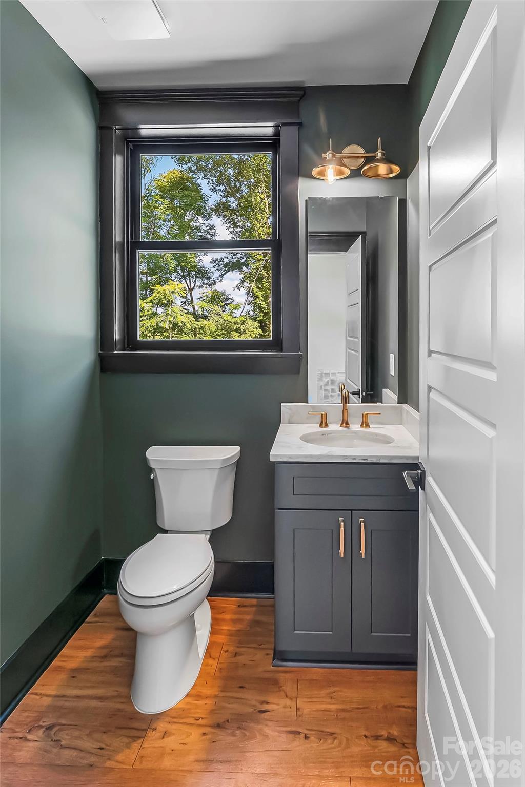 Main level powder room. - 4898 Soaring Top Lane, Lenoir