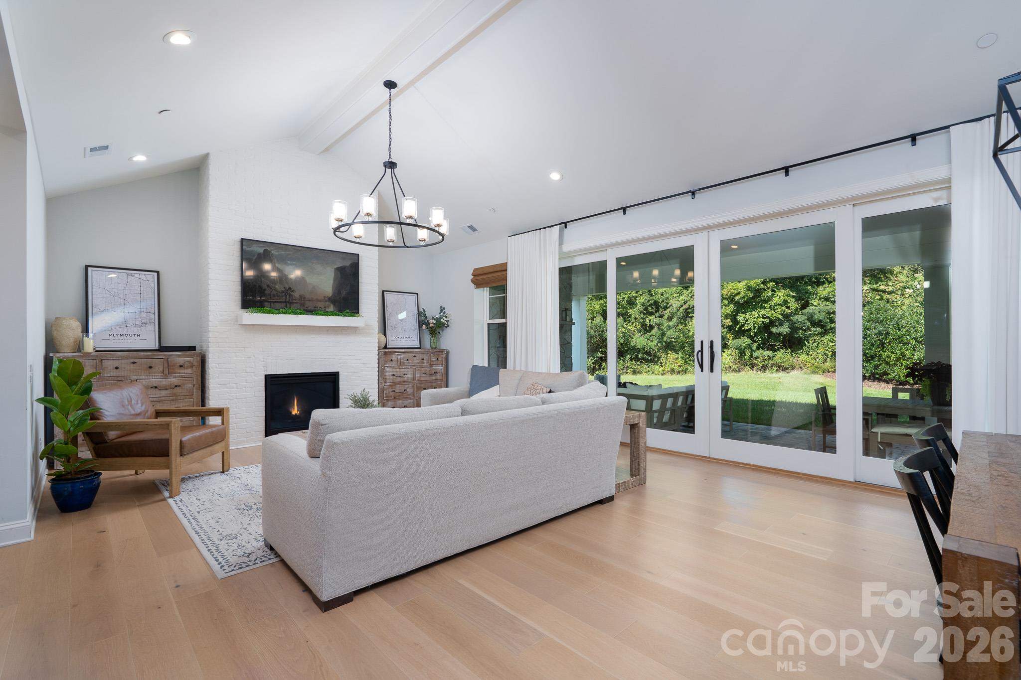 Vaulted Living Room Ceilings w/Brick Fireplace. Large 4 panel sliding Patio Door - 9588 Pacing Lane NW, Concord