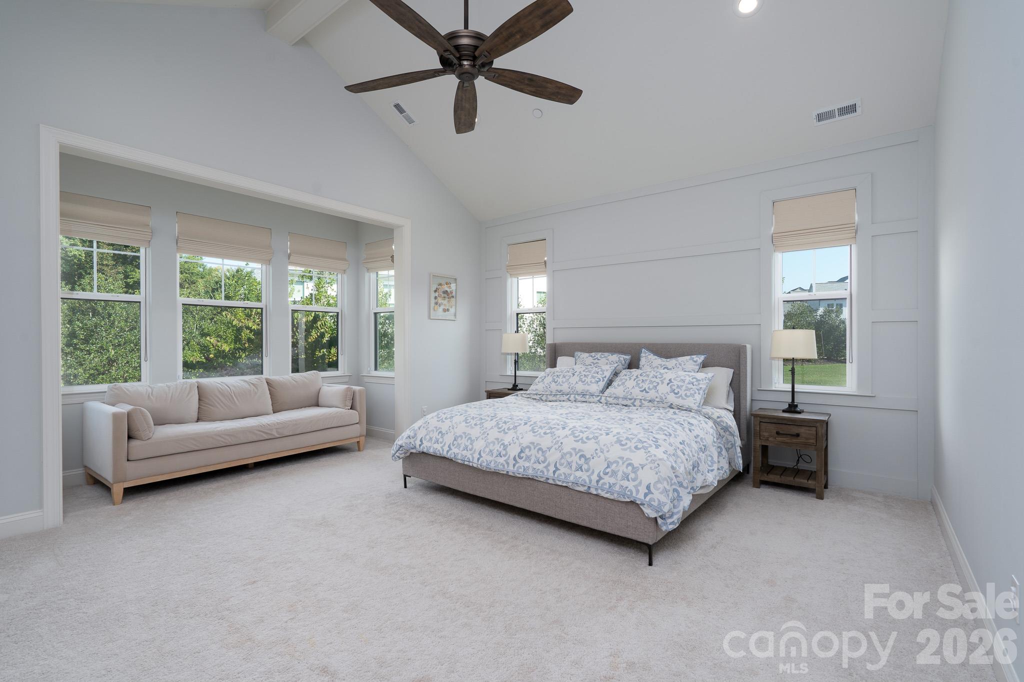 Expanded Primary Suite offers all the room you'll need plus a Sitting area surrounded by windows with view of back yard. - 9588 Pacing Lane NW, Concord